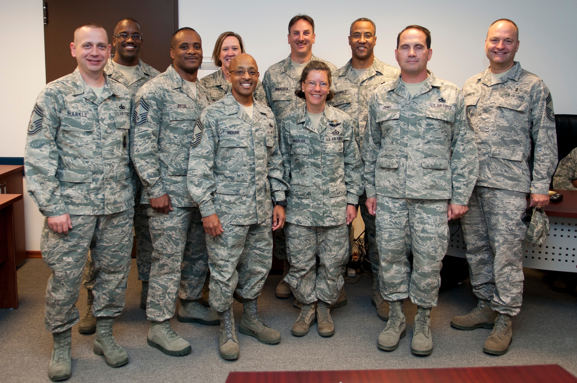Senior Master Sgts. Jonathan Moore and Doreen Wheeler pose with the Chief's Group members Oct. 3, 2011, at Incirlik Air Base, Turkey. Moore and Wheeler have been selected for promotion to chief master sergeant, the Air Force's highest enlisted rank. (U.S. Air Force photo by Tech. Sgt. Michael B. Keller/Released)