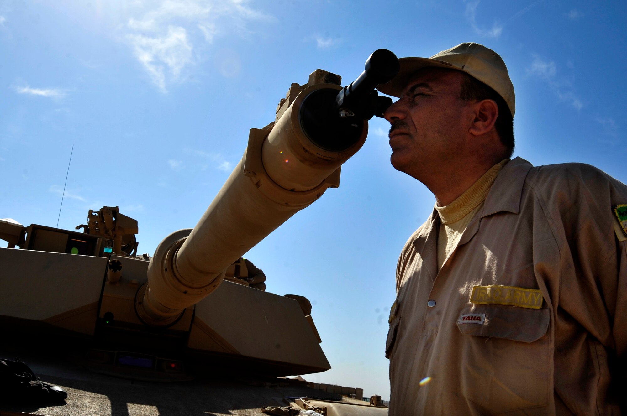 An Iraqi Army soldier looks through the sight of an M1A1 Abrams tank at a range in Besmaya, Iraq, Oct. 10, 2011.  (U.S. Air Force photo/Master Sgt. Cecilio Ricardo)