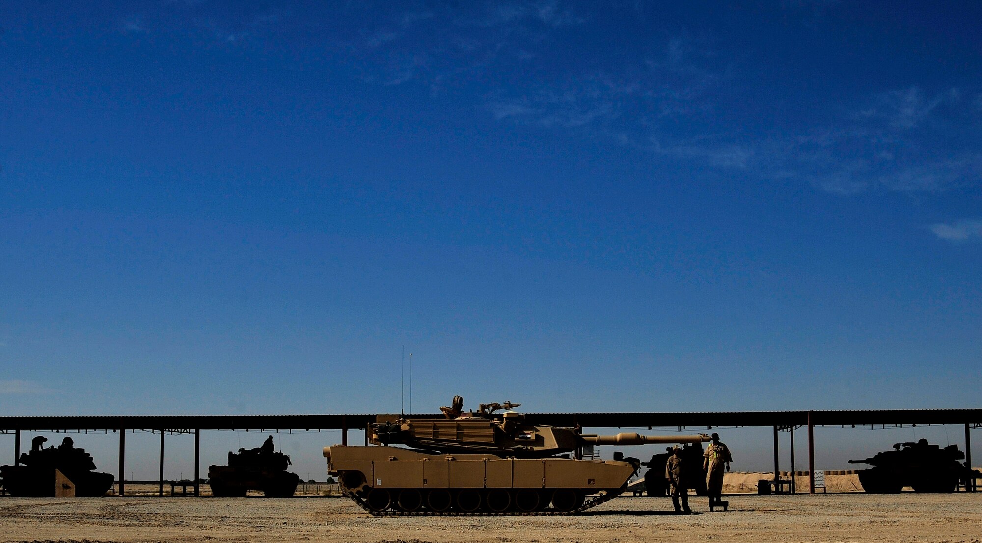 Iraqi Army soldiers sight an M1A1 Abrams tank at a range in Besmaya, Iraq, Oct. 10, 2011. (U.S. Air Force photo/Master Sgt. Cecilio Ricardo)