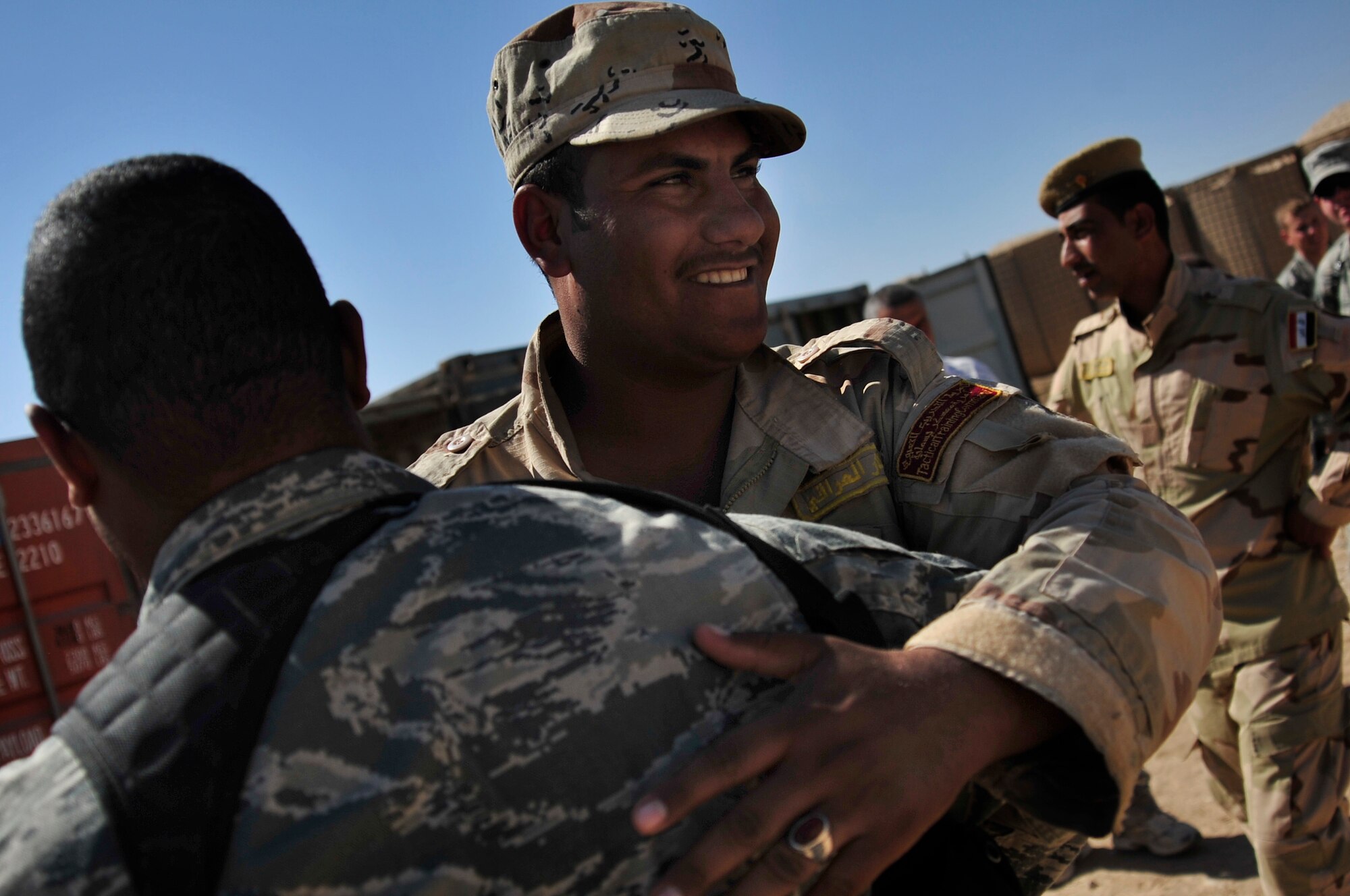 Tech. Sgt. Chermone Bunting, a combat munitions advisor with the Iraq Training and Advisory Mission- Army, says farewell to the Iraqi Army soldiers he advised during  his last session with them in Besmaya, Iraq, Oct. 10, 2011. Bunting is deployed from Sheppard Air Force Base, Texas, and is from Passaic, N. J. (U.S. Air Force photo/Master Sgt. Cecilio Ricardo)