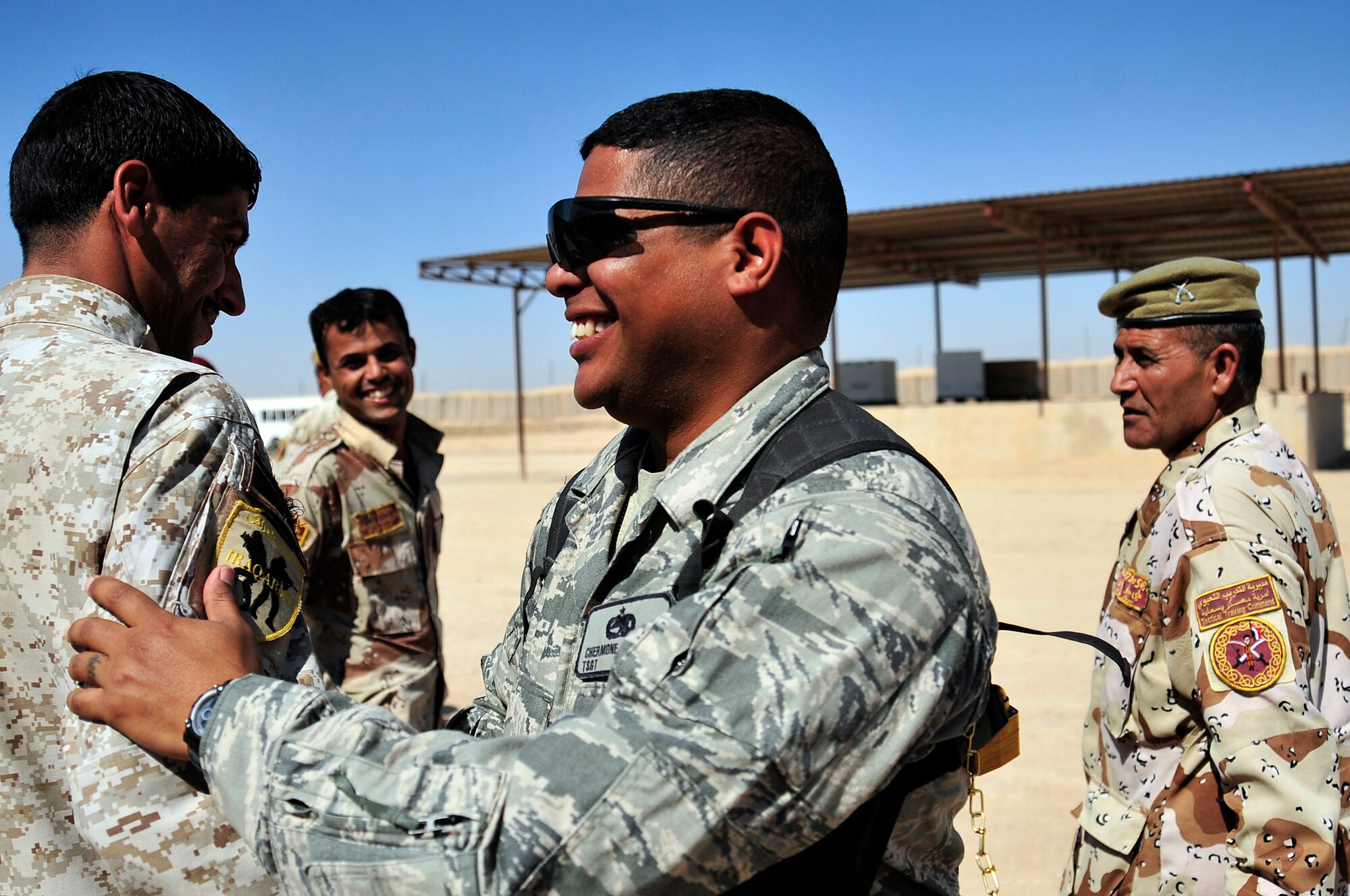 Tech. Sgt. Chermone Bunting, a combat munitions advisor with the Iraq Training and Advisory Mission- Army, says farewell to the Iraqi Army soldiers he advised during  his last session with them in Besmaya, Iraq, Oct. 10, 2011. Bunting is deployed from Sheppard Air Force Base, Texas, and is from Passaic, N. J. (U.S. Air Force photo/Master Sgt. Cecilio Ricardo)