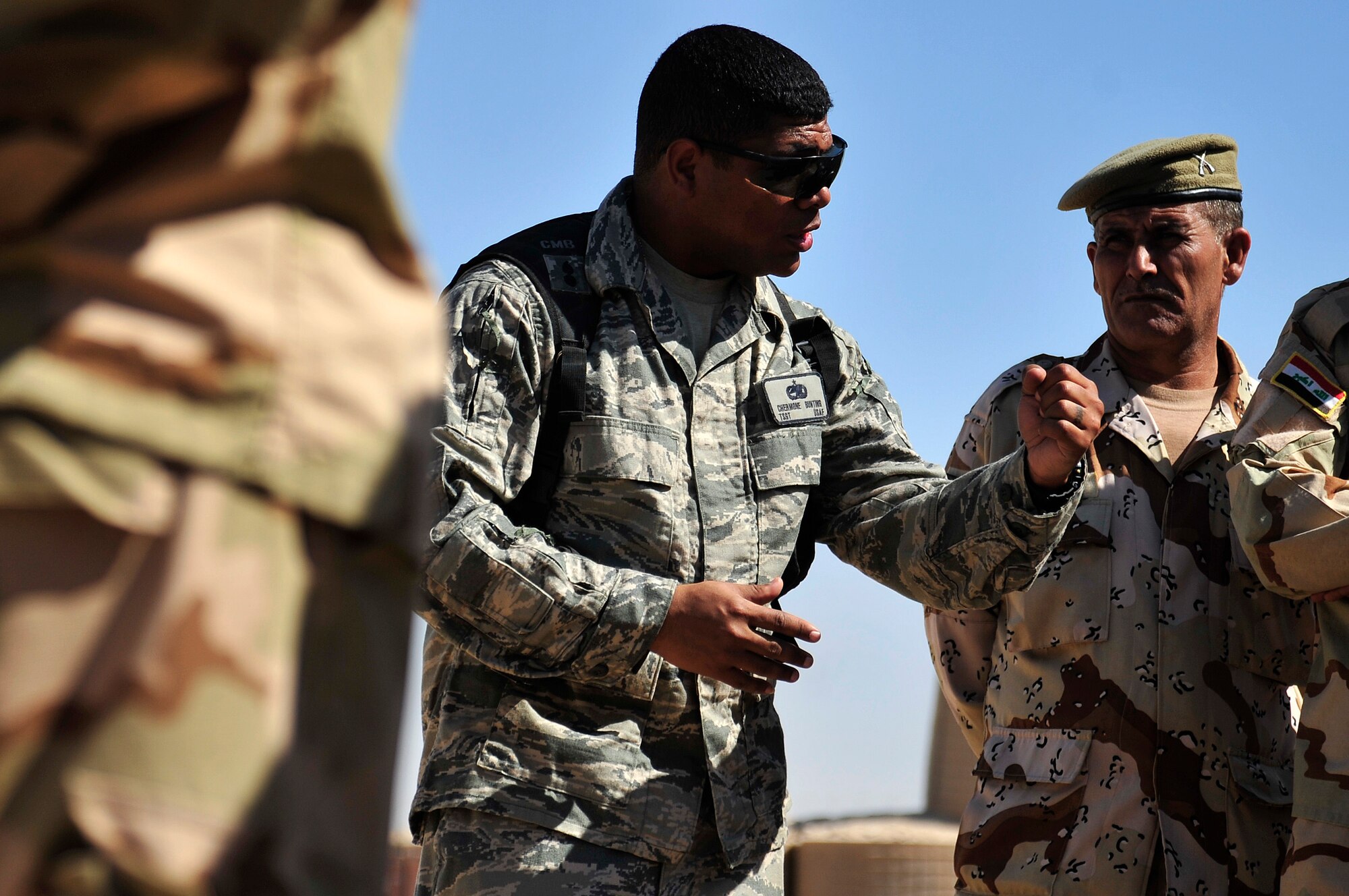Tech. Sgt. Chermone Bunting, a combat munitions advisor with the Iraq Training and Advisory Mission- Army, thanks Iraqi Army soldiers in Besmaya, Iraq, Oct. 10, 2011, for their diligence in learning. "I believe that you are the future of the Iraqi military and I am proud to have worked with you," said Bunting, during his last munitions advising session. Bunting is deployed from Sheppard Air Force Base, Texas, and is from Passaic, N. J. (U.S. Air Force photo/Master Sgt. Cecilio Ricardo))
