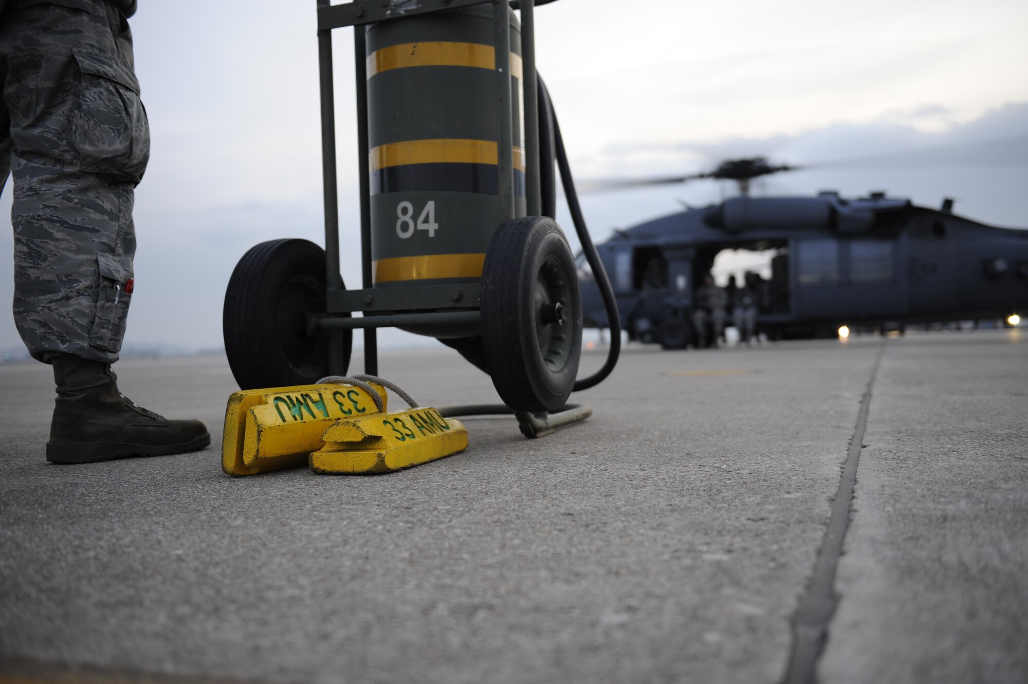 U.S. Air Force Airman 1st Class Matt Morris, 33rd Helicopter Maintenance Unit  HH-60 crew chiefs, from Kadena Air Base, Japan, prepares a Pave Hawk helicopter for take-off during exercise PACIFIC THUNDER Nov. 1, 2011 near Osan Air Base, Republic of Korea.

PACIFIC THUNDER is a 10-day exercise, from Oct. 31- Nov. 09,  at Osan AB. The exercise involves the 33rd Rescue Squadron from Kadena Air Base, Japan, and the 25th Fighter Squadron, Osan. These units work together to practice combat search and rescue tactics to prepare for real-world emergency situations. 
(U.S. Air Force photo/Tech. Sgt. Angelique Bilog)

