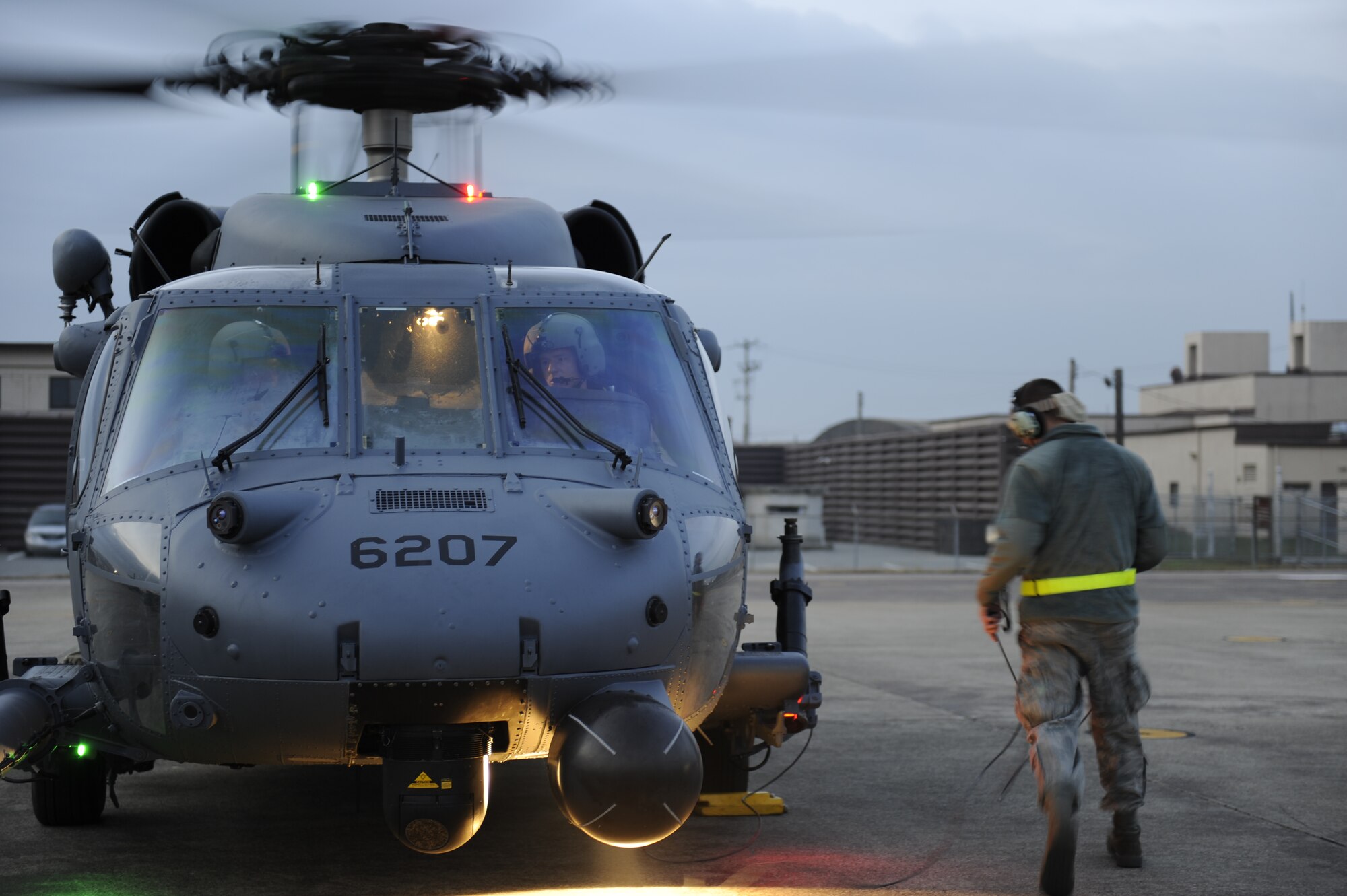 U.S. Air Force Airman 1st Class Matt Morris, a 33rd Helicopter Maintenance Unit HH-60 crew chief from Kadena Air Base, Japan, prepares a Pave Hawk helicopter for take-off during exercise Pacific Thunder Nov. 1, 2011, near Osan Air Base, Republic of Korea. 

Pacific Thunder is a 10-day exercise, from Oct. 31 to Nov. 9 at Osan AB. The exercise involves the 33rd Rescue Squadron from Kadena AB, Japan, and the 25th Fighter Squadron from Osan. These units work together to practice combat search and rescue tactics to prepare for real-world emergency situations. (U.S. Air Force photo/Tech. Sgt. Angelique Bilog/released)
