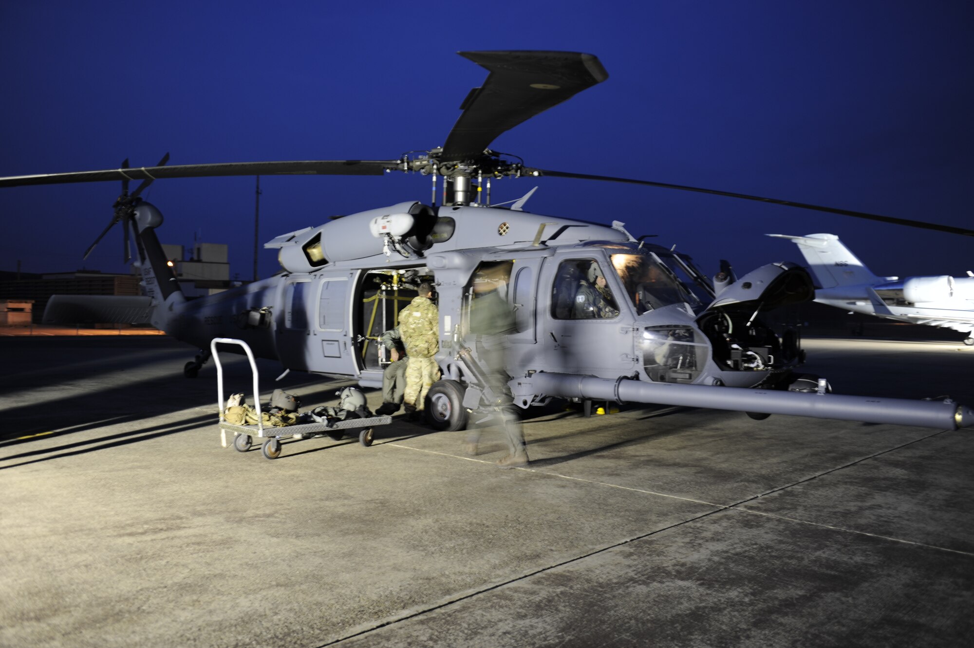 33rd Helicopter Maintenance Unit HH-60 crew chiefs, from Kadena Air Base, Japan, prepare a Pave Hawk helicopter before it takes off on a training flight during exercise Pacific Thunder Nov. 1, 2011 near Osan Air Base, Republic of Korea. Pacific Thunder is a 10-day exercise, from Oct. 31 to Nov. 9 at Osan. The exercise involves the 33rd Rescue Squadron from Kadena AB, Japan, and the 25th Fighter Squadron from Osan. These units work together to practice combat search and rescue tactics to prepare for real-world emergency situations. (U.S. Air Force photo/Tech. Sgt. Angelique Bilog/released)

