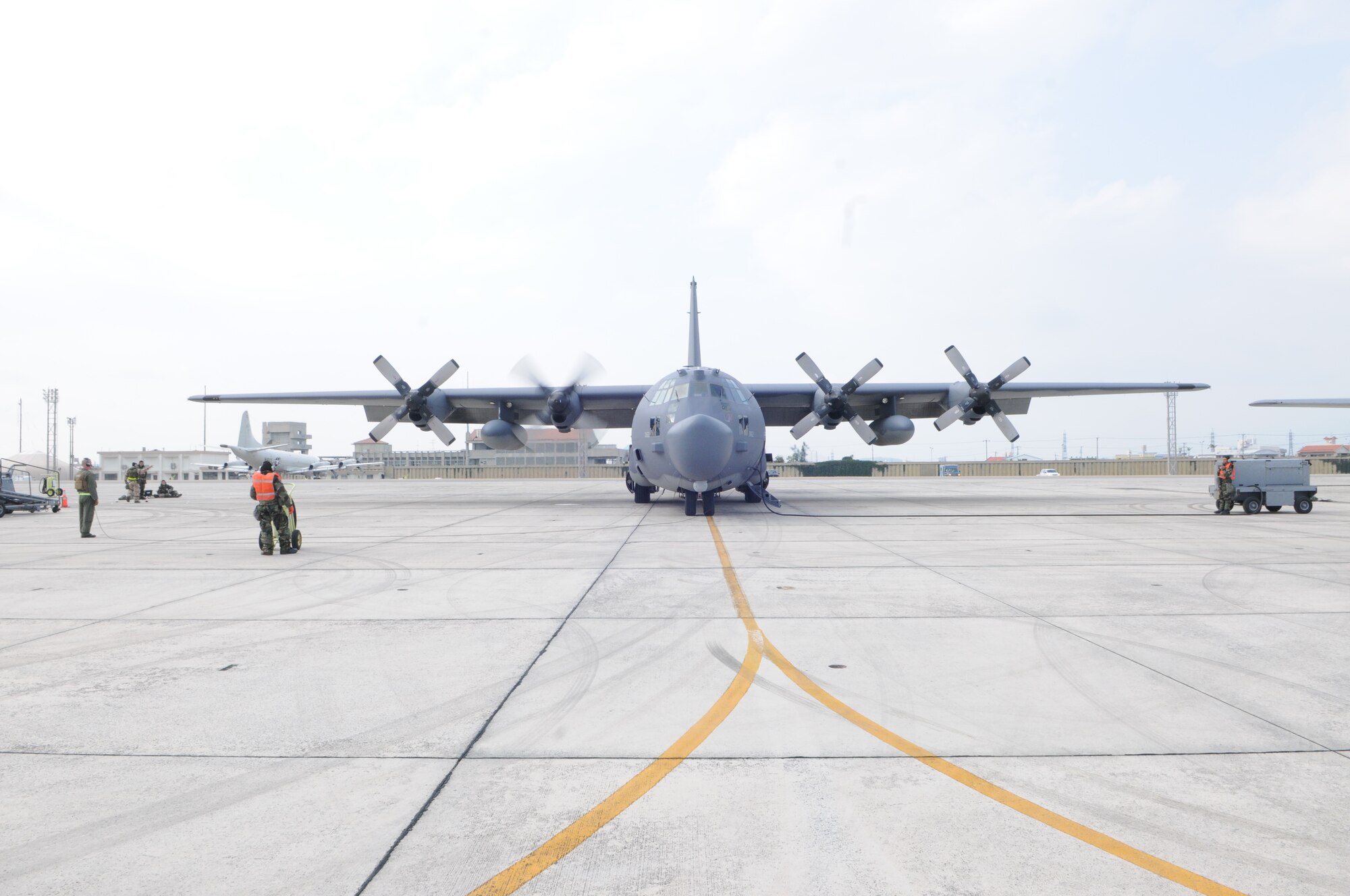 KADENA AIR BASE, Japan -- Tech. Sgt. Aaron Kay, a loadmaster with the 1st Special Operations Squadron, and maintainers from the 353rd Special Operations Maintenance Squadron monitor the engine start of a MC-130H Combat Talon II during a local operational readiness exercise here Oct 26. Airmen from the 353rd Special Operations Group honed their wartime readiness during exercise Beverly High 12-1 Oct. 24-28 (U.S. Air Force photo by Tech. Sgt. Aaron Cram)