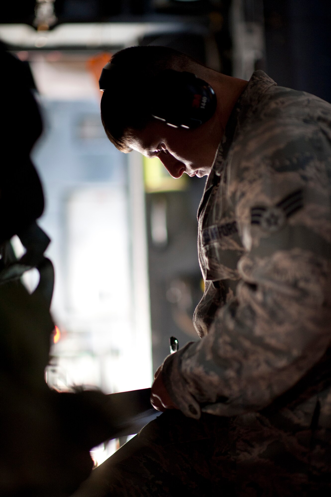 YOKOTA AIR BASE, Japan -- Senior Airman Matthew Ramos, 374th Operations Support Squadron, checks flight equipment on a C-130 Hercules at Yokota Air Base, Japan, Nov. 2, 2011. Senior leaders called for maximum participation during the Samurai Surge that day, a training exercise involving formation air drops. (U.S. Air Force photo/Staff Sgt. Samuel Morse)