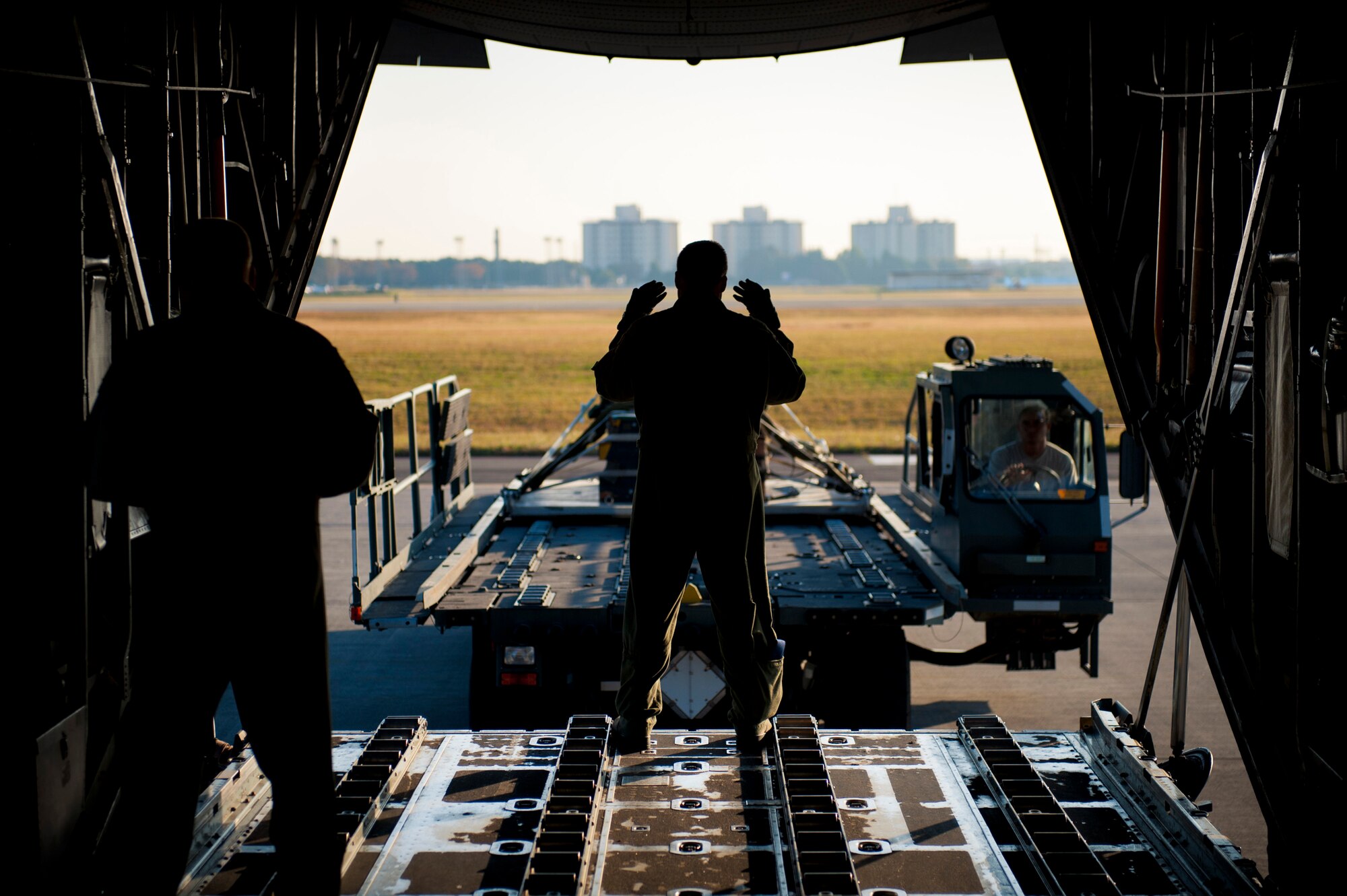 YOKOTA AIR BASE, Japan -- Crews load a heavy equipment training bundle onto a C-130 Hercules at Yokota Air Base, Japan, Nov. 2, 2011. The training bundle was dropped at a training drop zone near Mount Fuji as part of a Samurai Surge, a training exercise involving formation air drops. (U.S. Air Force photo/Staff Sgt. Samuel Morse)