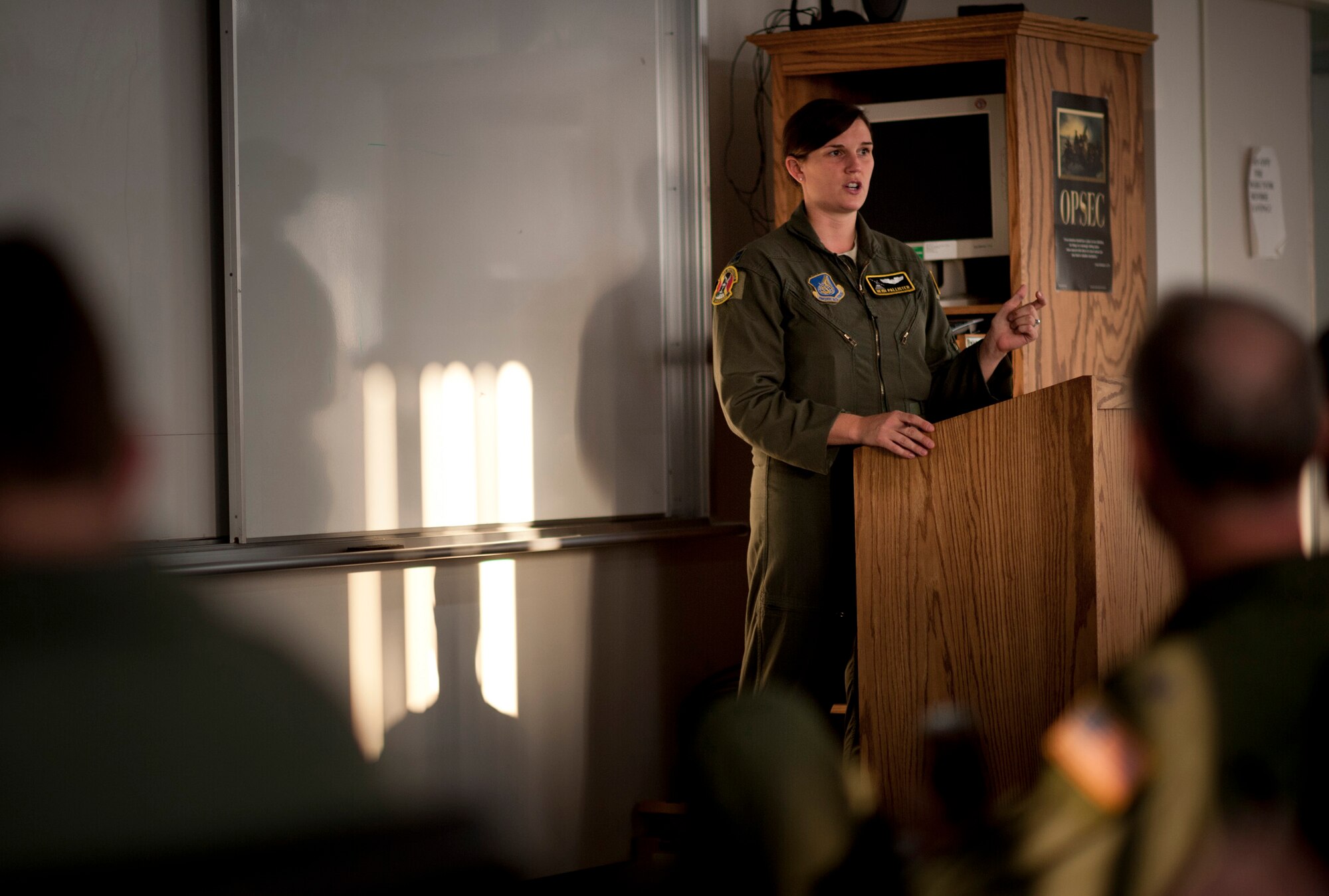 YOKOTA AIR BASE, Japan -- Capt. Heidi Pallister, 36th Airlift Squadron pilot, gives a pre-flight brief at Yokota Air Base, Japan, Nov. 2, 2011. The 36th AS, with the help of numerous agencies across the base, flew a Samurai Surge, launching six C-130s to perform formation airdrop training missions. (U.S. Air Force photo/Staff Sgt. Samuel Morse)