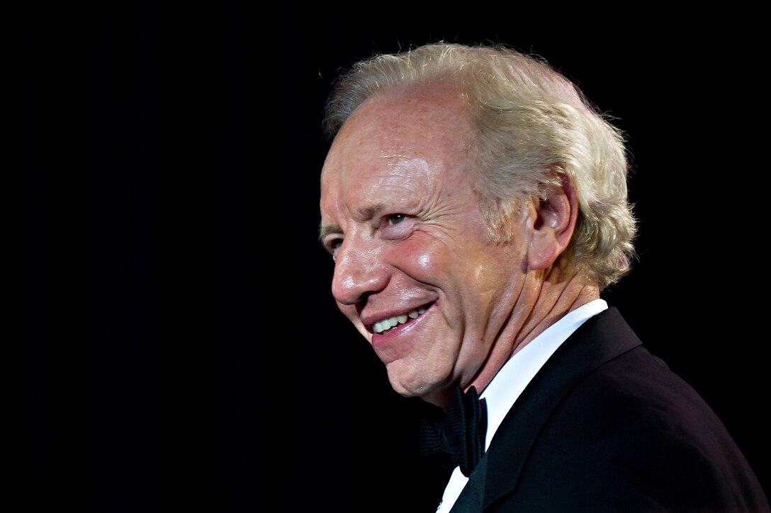 U.S. Sen. Joe Lieberman of Connecticut walks to the stage to recieve the  2011 National Defense University Foundation American Patriot Award in Washington, D.C., Nov. 3, 2011.
