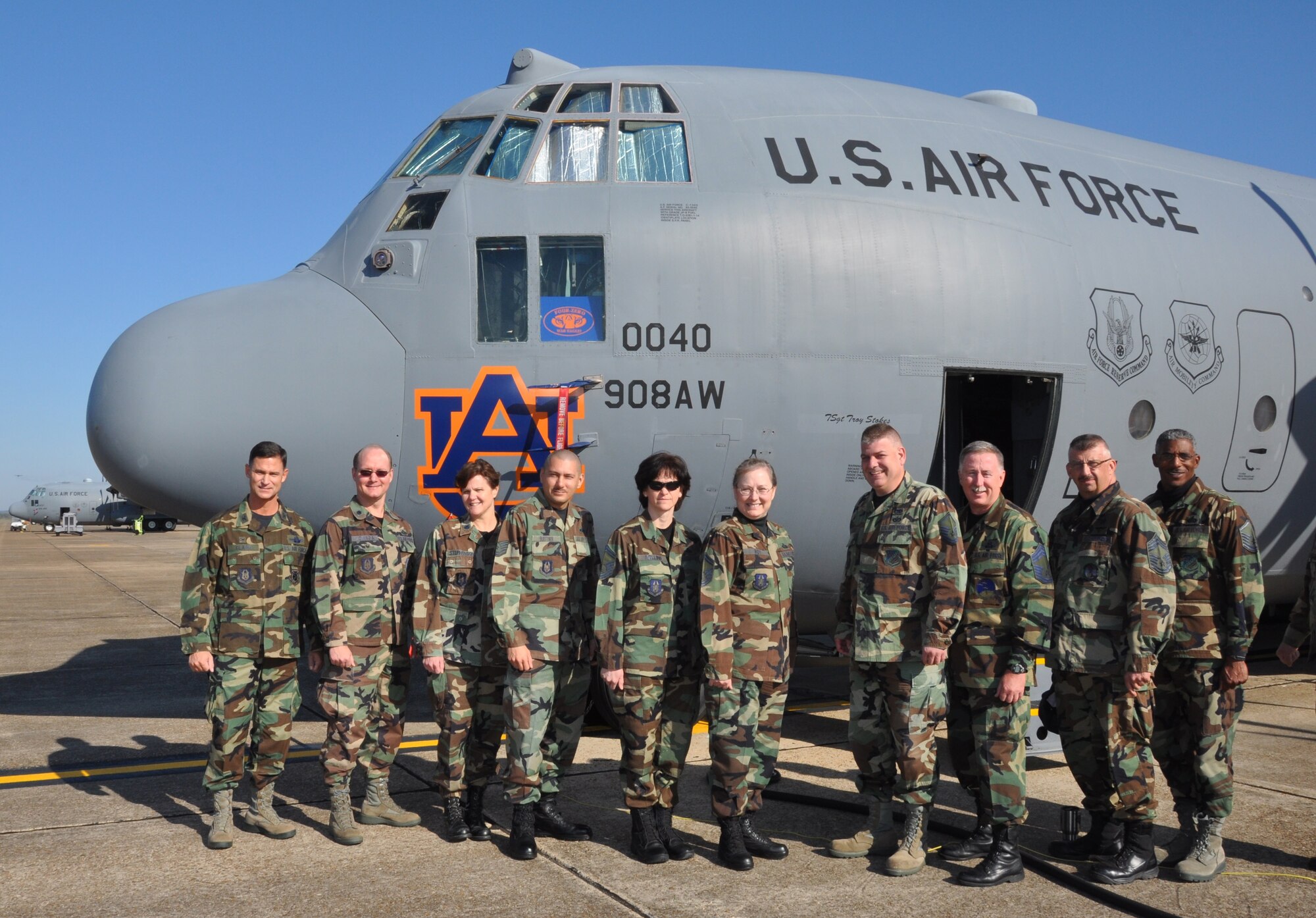 Col. Brett Clark, commander of the 908th Airlift Wing, left, and several members of his wing pose in Battle Dress Uniforms, or BDUs, one last time on Monday, the last day that uniform could be officially worn. After more than 30 years in service, BDUs are history, replaced by the Airman's Combat Uniform. (Air Force photo/Lt. Col. Jerry Lobb)