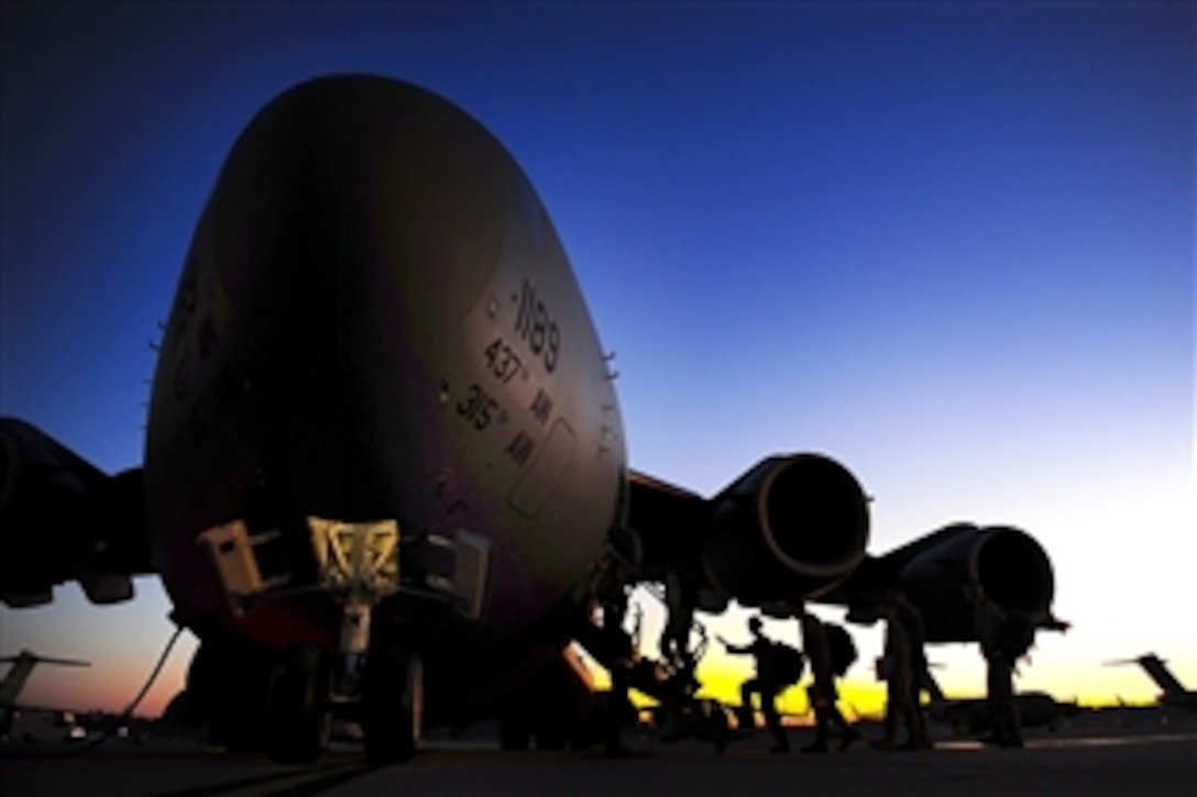 Airmen assigned to the 437th Airlift Wing work on a C-17 Globemaster III aircraft in an operational readiness evaluation that was staged in Gulfport, Miss., Oct. 25, 2011. The evaluation was intended to determine Joint Base Charleston's ability to fight and objectively measure mission effectiveness.