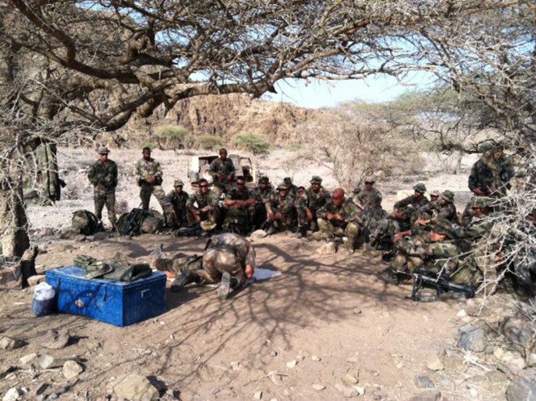 Members of Centre d'Entranement au Combat et d'Aguerrissement de Djibouti, French Forces Djibouti, give a class on survival skills to Marines with Company G and L Battery, Battalion Landing Team (BLT), 2nd Battalion, 2nd Marine Regiment, 22nd Marine Expeditionary Unit (MEU), during a desert survival course, Nov. 4, 2011.  The 22nd MEU is currently deployed as part of the Bataan Amphibious Ready Group (BATARG) as the U.S. Central Command theater reserve force, also providing support for maritime security operations and theater security cooperation efforts in the U.S. 5th Fleet area of responsibility.