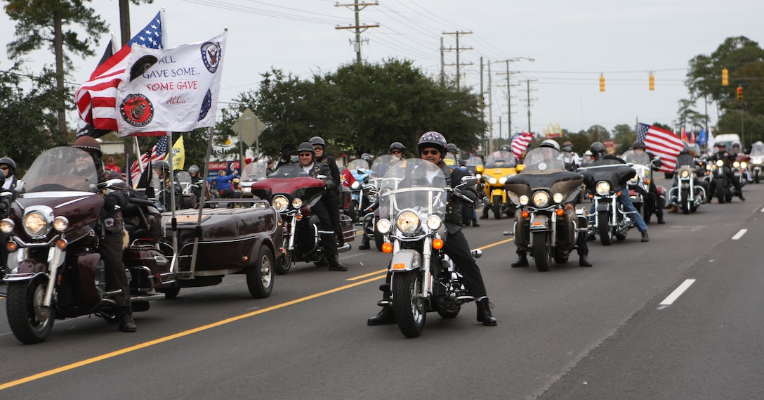 Rolling Thunder Chapter NC-5 cruised in an organized mass during the Veterans Day Parade in Jacksonville, Saturday. More than 2,000 people with various organizations marched to show appreciation and honor to service members and their families.