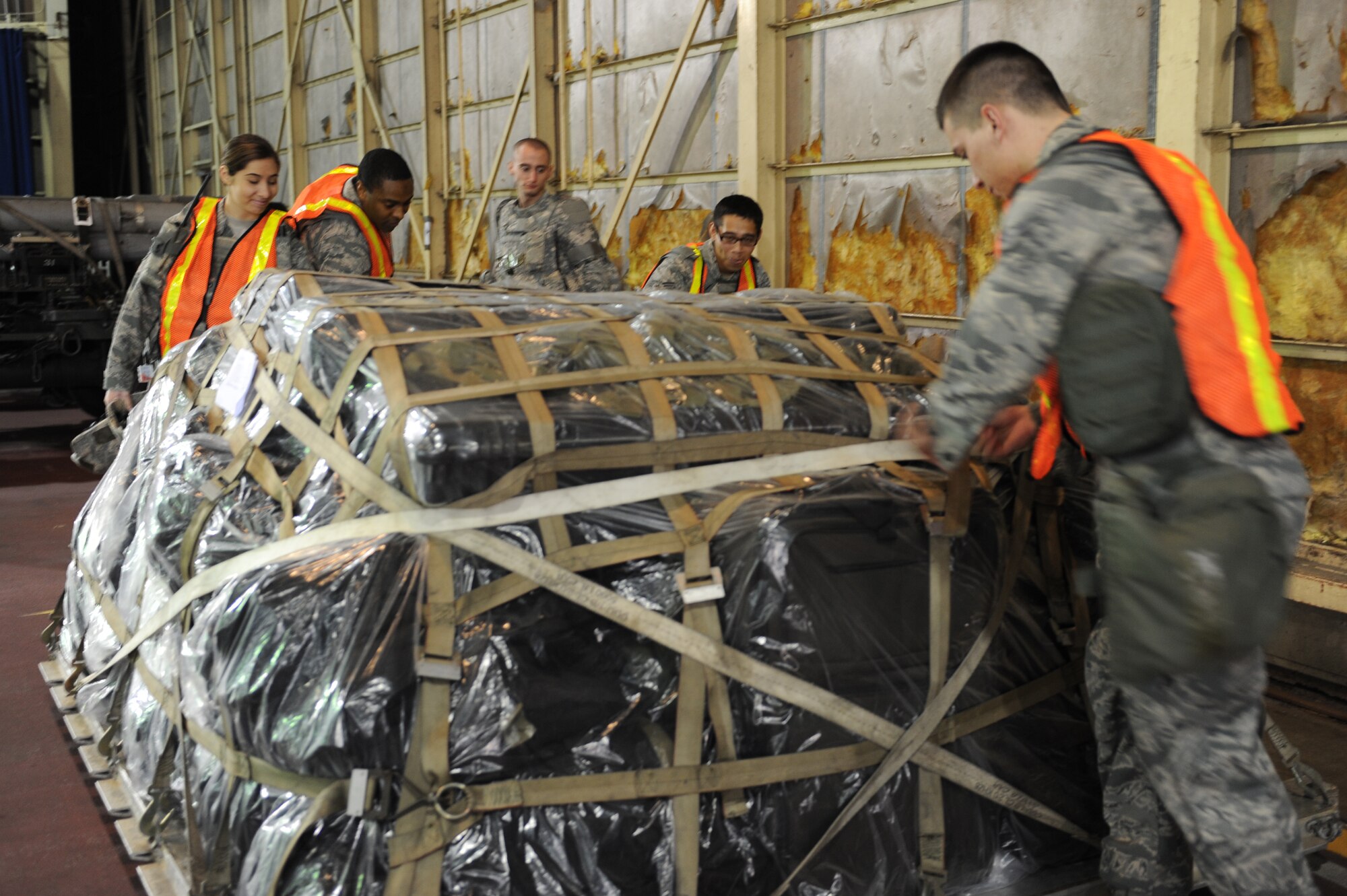 MISAWA AIR BASE, Japan – Members of the 35th Security Forces Squadron inspect cargo during an operational readiness exercise here Nov. 6. The 35th Fighter Wing is preparing for an operational readiness inspection in December. (U.S. Air Force photo by Airman 1st Class Kia Atkins)