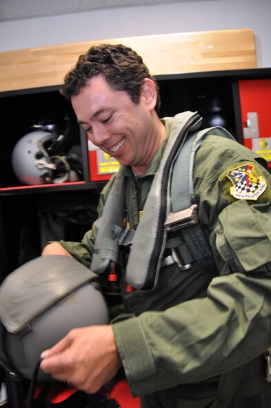 Chaffetz grabs his helmet before he heads out to the flightline for his F-16 familiarization flight. (U.S. Air Force photo/Airman 1st Class Crystal Charriere)