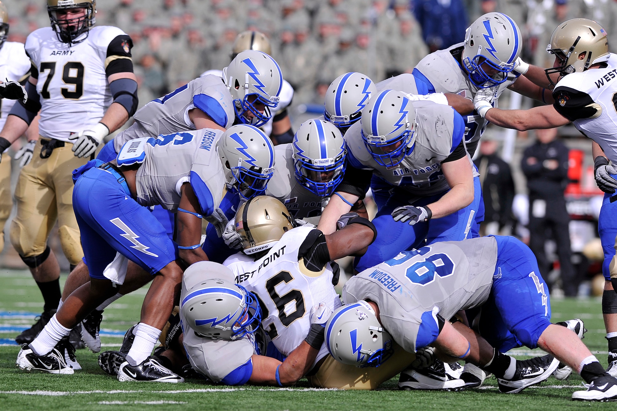 Air Force defenders swarm Army running back Larry Dixon in the Air Force-Army game at Falcon Stadium Nov. 5, 2011. The Falcons capitalized on five Army turnovers to defeat the Black Knights, 24-14. (U.S. Air Force photo/Raymond McCoy)