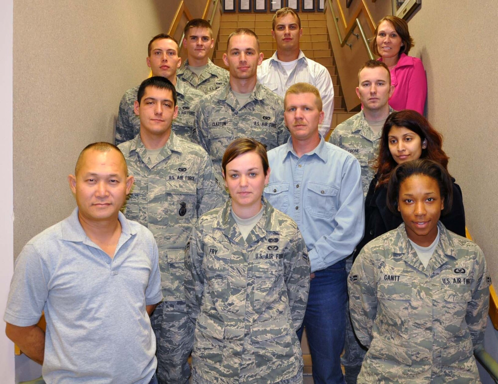 The 931st Air Refueling Group, McConnell Air Force Base, Kan., welcomed 12 new members during the November UTA.  Pictured are, front row, Staff Sgt. Matthew Chounlamany, Airman 1st Class Ellie Fry, Airman 1st Class Stefani Gant, second row, Airman 1st Class Cody Cox, Tech. Sgt. Steven Petersen, Capt. Sabera Shabnam, third row, Airman 1st Class Michael Schmidt, Airman 1st Class Jared Claxton, Staff Sgt. David Crone, fourth row, Airman 1st Class Kyle Kozik, Staff Sgt. Dustin Wileman, and Tech. Sgt. Robyn Thomas. (U.S. Air Force photo by Tech. Sgt. Brannen Parrish)