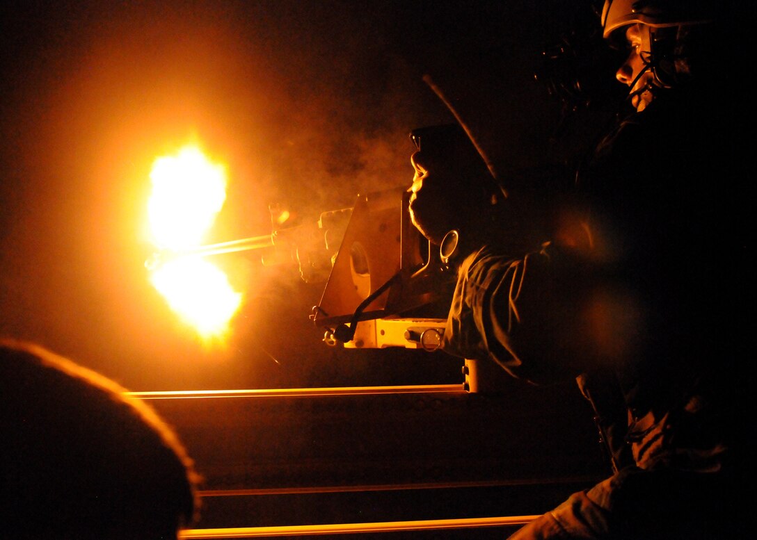 A 23rd Special Tactics Training Squadron student returns fire with an M-249 from a Humvee during a recent two-day exercise at Duke Field Fla.  Hurlburt Field Airmen were dropped to the exercise location by a 919th Special Operations Wing MC-130E Combat Talon I to begin the exercise.  The exercise provided counter-insurgency tactics, land navigation and mission planning to potential Air Force combat controllers.  (U.S. Air Force photo/Tech. Sgt. Cheryl Foster)