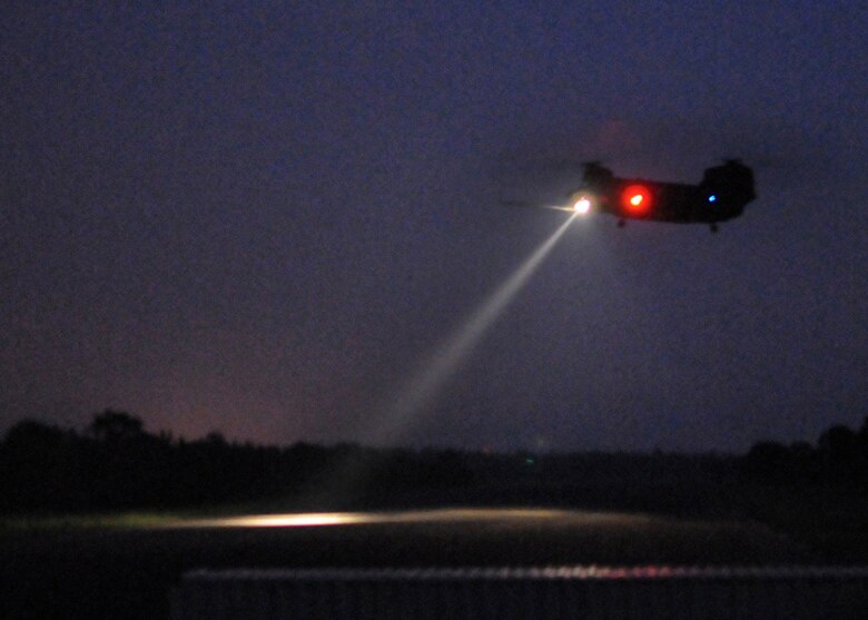 A CH-47 Chinook lifts off after dropping off Airmen during a recent two-day exercise at Duke Field Fla.  Hurlburt Field Airmen were also dropped into the exercise location by a 919th Special Operations Wing MC-130E Combat Talon I to begin the exercise.  The exercise provided counter-insurgency tactics, land navigation and mission planning to potential Air Force combat controllers.  (U.S. Air Force photo/Tech. Sgt. Cheryl Foster)
