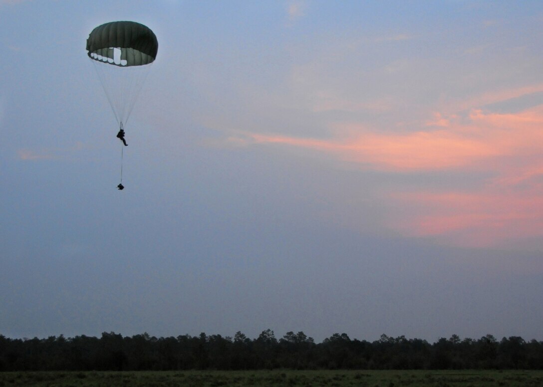 A 23rd Special Tactics Training Squadron student drifts down to the ground after jumping from a MC-130E Combat Talon I during a recent two-day exercise at Duke Field Fla.  The aircrew of reservists delivered approximately six Hurlburt Field Airmen and their equipment to their coordinates to begin the exercise.  The exercise provided counter-insurgency tactics, land navigation and mission planning to potential Air Force combat controllers.  (U.S. Air Force photo/Tech. Sgt. Cheryl Foster)