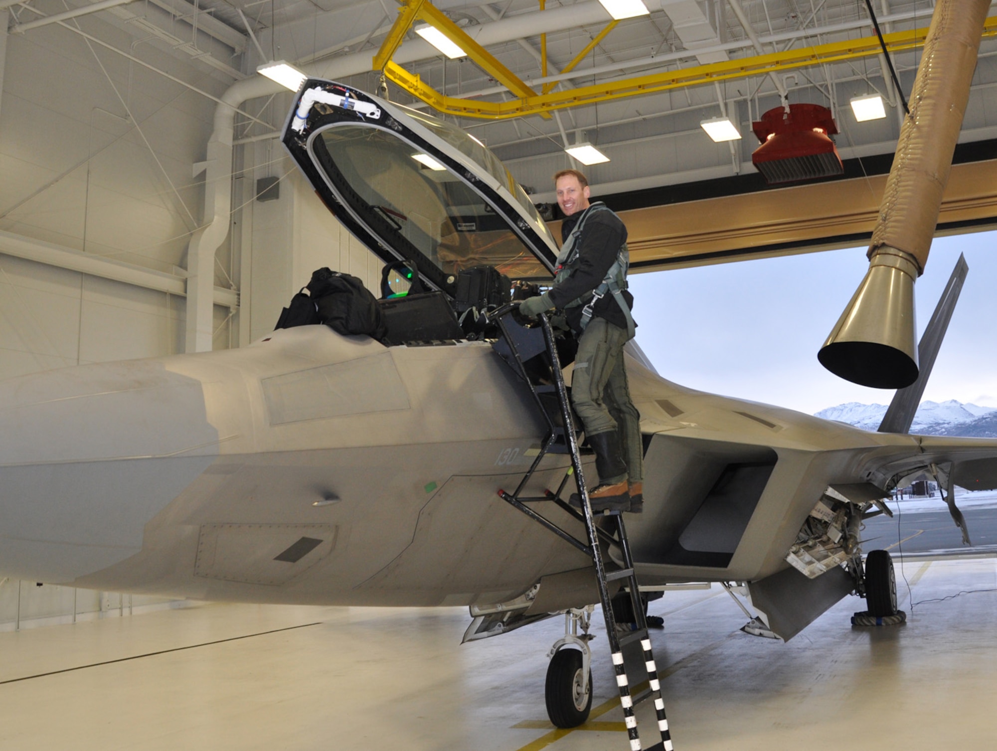 Lt. Col. David Piffarerio, 302nd Fighter Squadron commander, climbs into an F-22 prior to take-off Nov. 4.