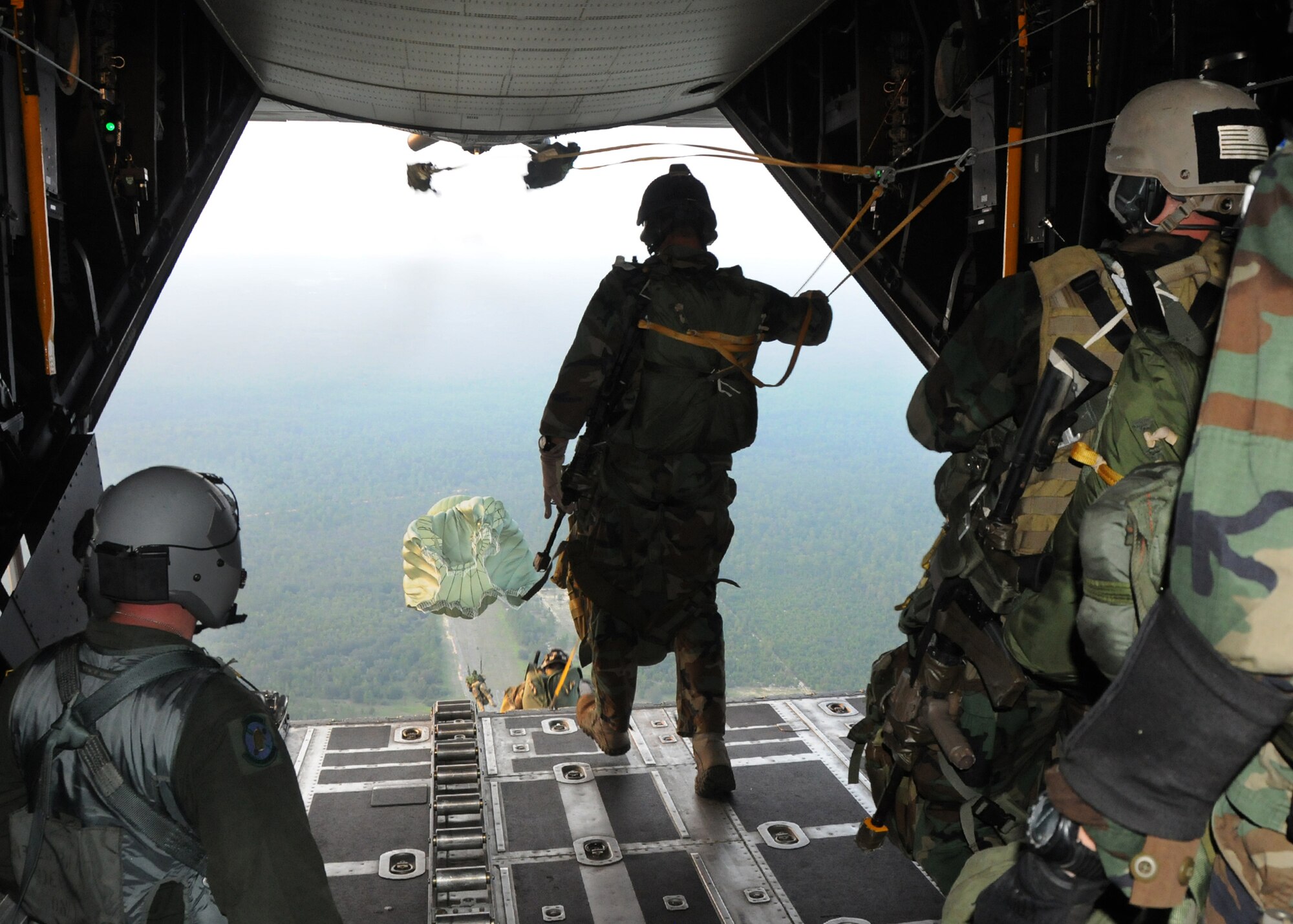 Students with the 23rd Special Tactics Training Squadron, leap from a MC-130E Combat Talon I from the 919th Special Operations Wing during a recent mission as part of a two-day exercise at Duke Field, Fla.  The aircrew of reservists delivered approximately six Hurlburt Field Airmen and their equipment to their coordinates to begin the exercise.  The exercise provided counter-insurgency tactics, land navigation and mission planning to potential Air Force combat controllers.  (U.S. Air Force photo/Tech. Sgt. Cheryl Foster)