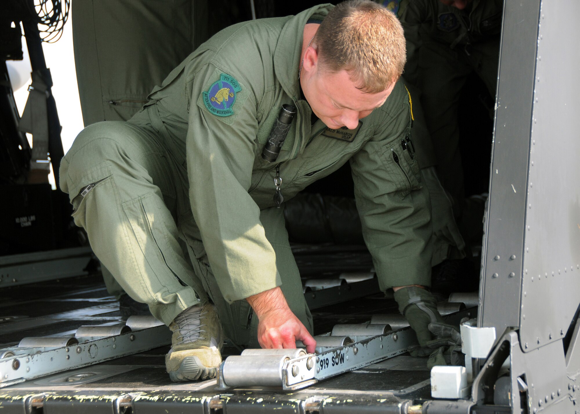Senior Airman Donald McNaron, a loadmaster with the 711th Special Operations Wing, prepares the tracks on the back of a MC-130E Combat Talon during a recent jump mission as part of a two-day 23rd Special Tactics Training Squadron exercise at Duke Field, Fla.  The aircrew of reservists delivered approximately six Hurlburt Field Airmen and their equipment to their coordinates to begin the exercise.  The exercise provided counter-insurgency tactics, land navigation and mission planning to potential Air Force combat controllers.  (U.S. Air Force photo/Tech. Sgt. Cheryl Foster)