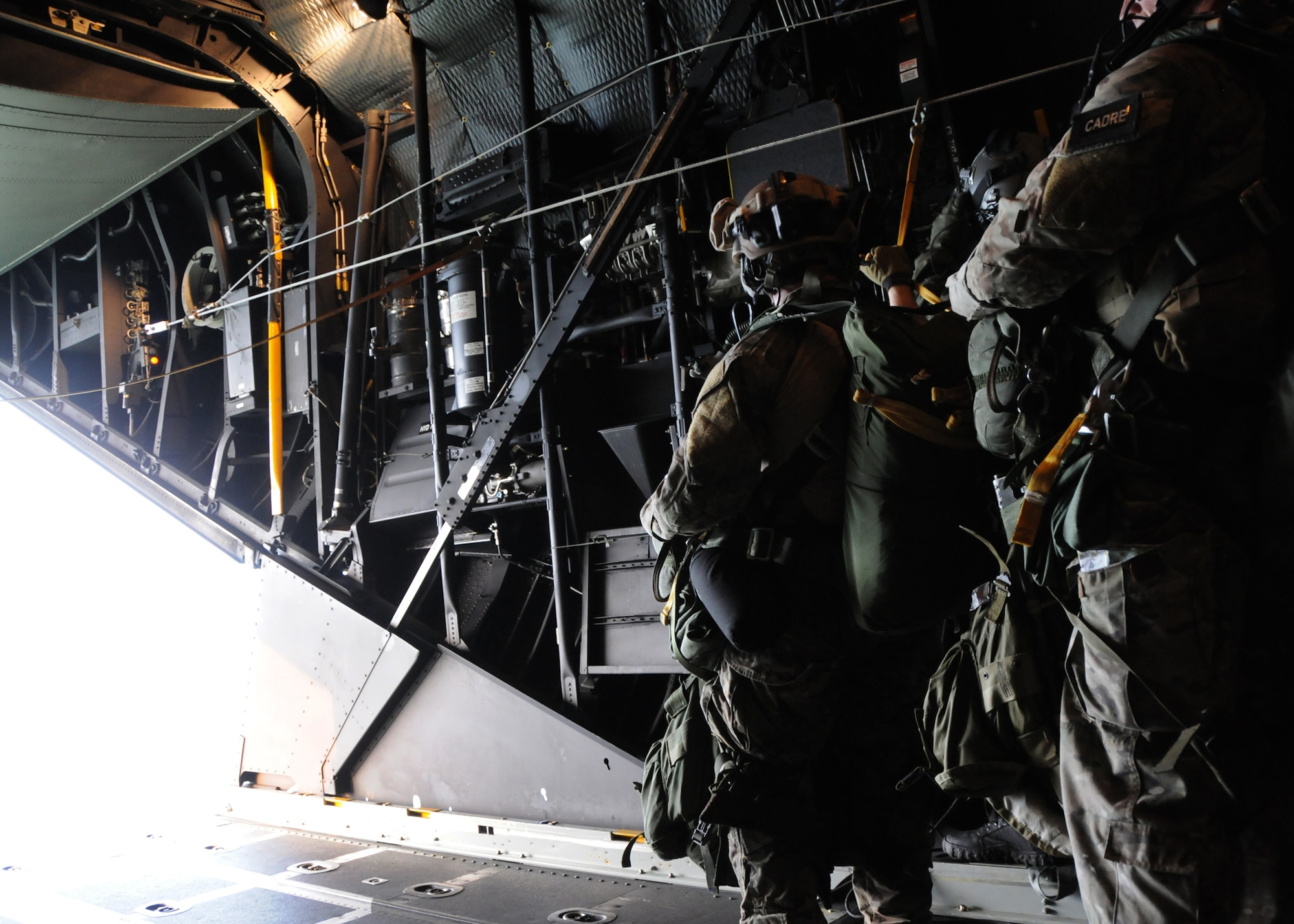 A student with the 23rd Special Tactics Training Squadron, waits for the word to go before leaping from a MC-130E Combat Talon I from the 919th Special Operations Wing during a recent mission as part of a two-day exercise at Duke Field, Fla.  The aircrew of reservists delivered approximately six Hurlburt Field Airmen and their equipment to their coordinates to begin the exercise.  The exercise provided counter-insurgency tactics, land navigation and mission planning to potential Air Force combat controllers.   (U.S. Air Force photo/Tech. Sgt. Cheryl Foster)