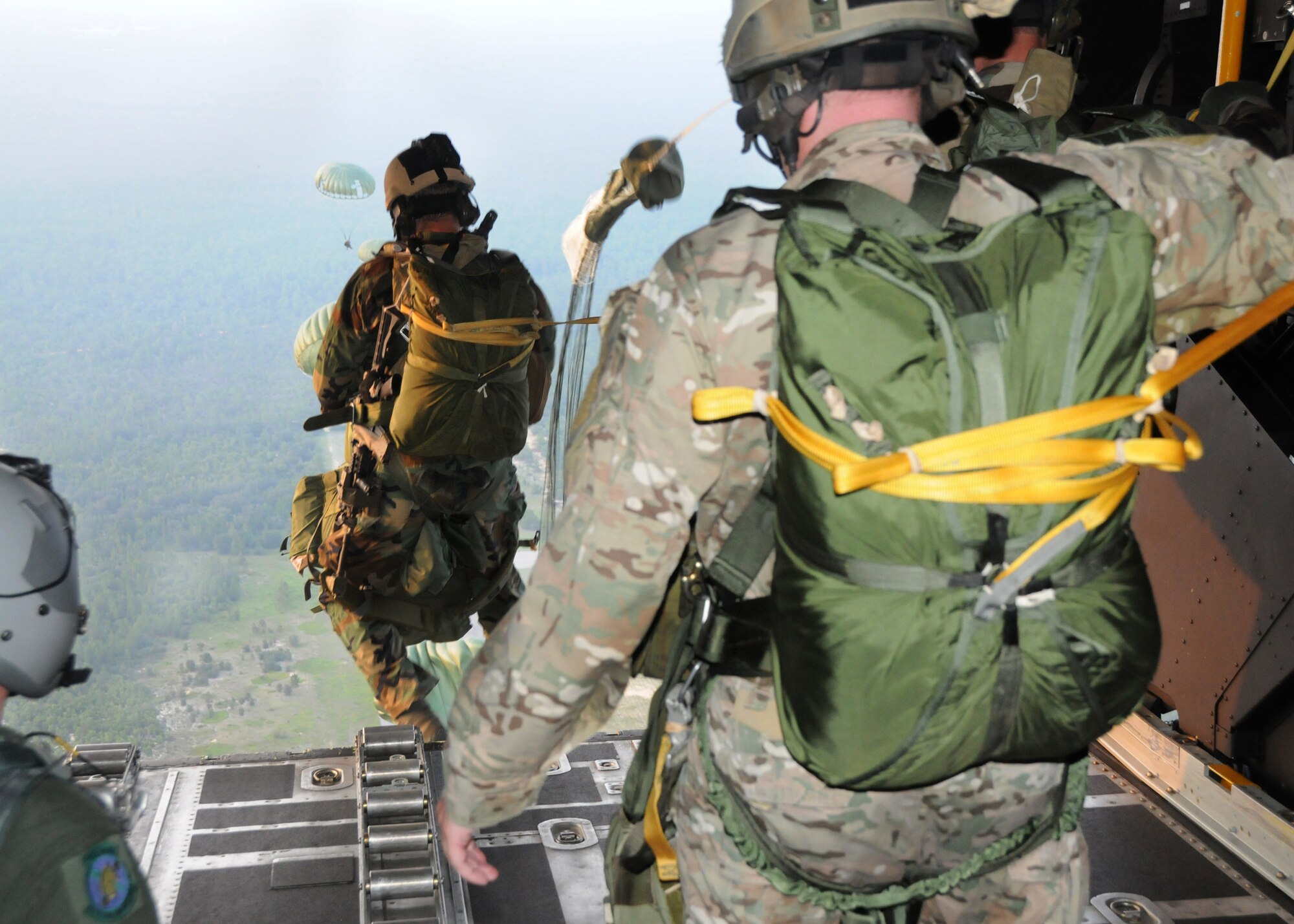 Students with the 23rd Special Tactics Training Squadron, leap from a MC-130E Combat Talon I from the 919th Special Operations Wing during a recent mission as part of a two-day exercise at Duke Field, Fla.  The aircrew of reservists delivered approximately six Hurlburt Field Airmen and their equipment to their coordinates to begin the exercise.  The exercise provided counter-insurgency tactics, land navigation and mission planning to potential Air Force combat controllers.  (U.S. Air Force photo/Tech. Sgt. Cheryl Foster)