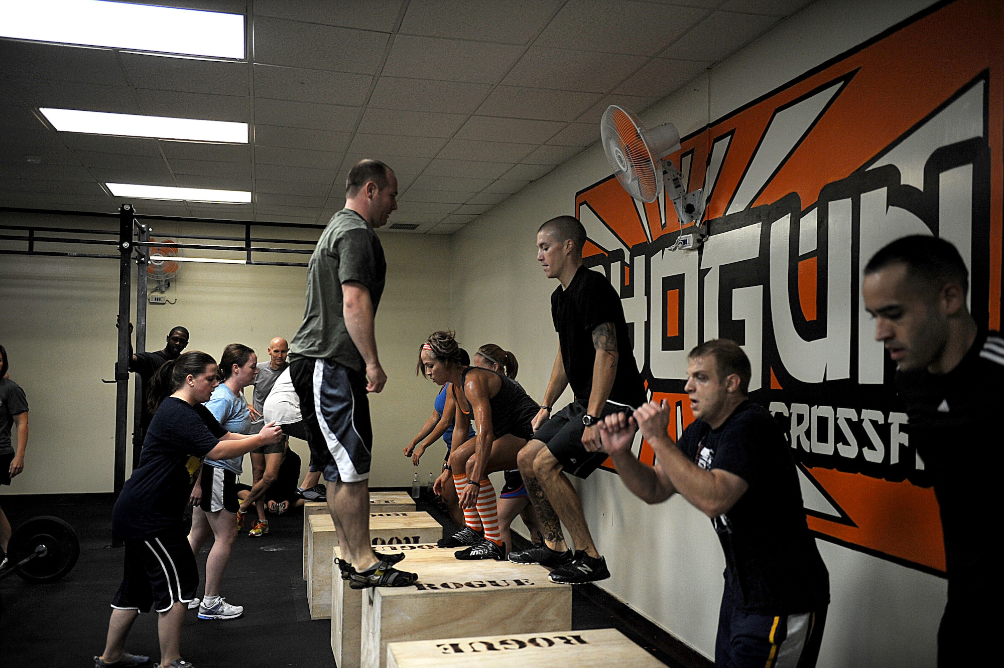 Shogun Crossfit participants perform jump ups during a special Saturday morning work out of the day at Kadena Air Base, Japan Nov. 5, 2011. Shogun crossfitters came out for a special Saturday morning WOD for U.S. Air Force Lt. Gen Burt Field, U.S. Forces Japan and 5th Air Force commander, who helped finance the Crossfit program in both Okinawa and mainland Japan. (U.S. Air Force photo/Airman 1st Class Brooke P. Beers/released)