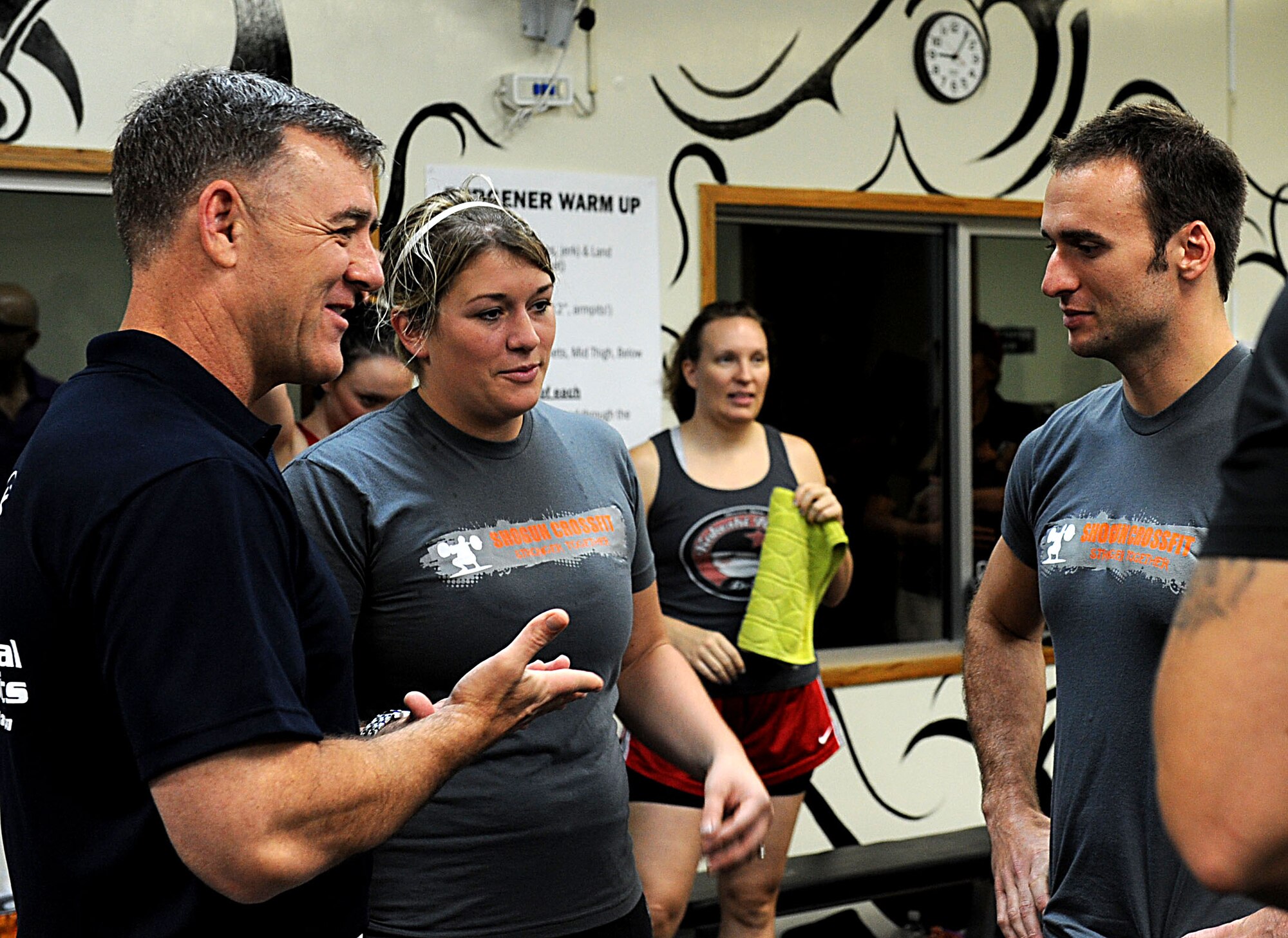 U.S. Air Force Lt. Gen Burt Field, U.S. Forces Japan and 5th Air Force commander, talks with Shogun Crossfit trainers during a special Saturday morning work out of the day at Kadena Air Base, Japan Nov. 5, 2011. Field helped finance the Crossfit program in both Okinawa and mainland Japan. (U.S. Air Force photo/Airman 1st Class Brooke P. Beers/released)