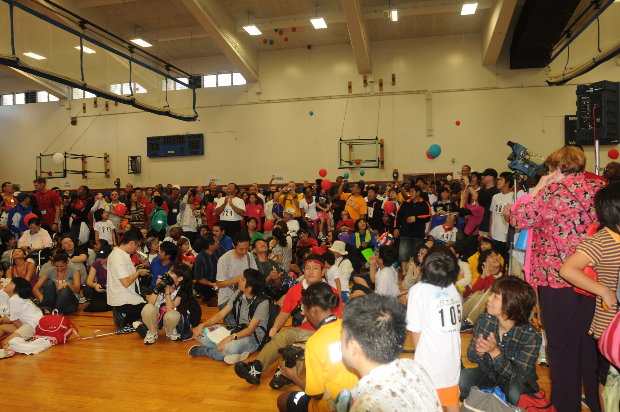 Kadena Special Olympics athletes release balloons during the KSO opening ceremony at the Risner Fitness Center on Kadena Air Base, Japan, Nov. 5, 2011.  Thousands of spectators and regional leaders from Japan and the United States came out to show support for more than 870 athletes and artists participating in the 12th Annual KSO Games and Art Show. (U.S. Air Force photo/Tech. Sgt. Amanda Savannah/released)