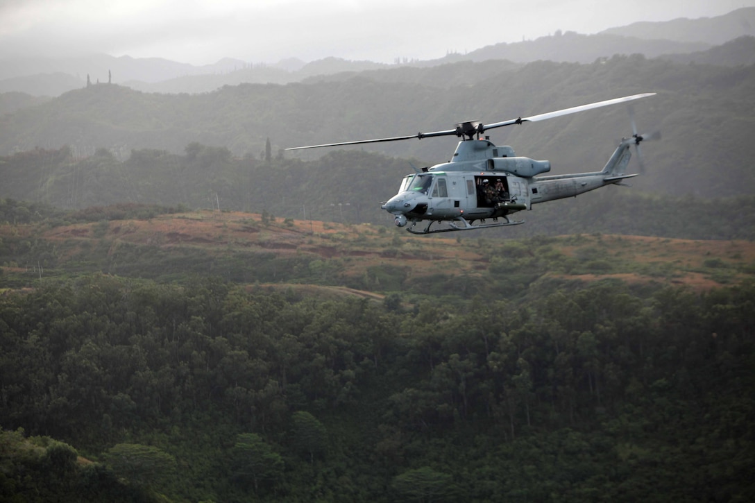 A UH-1Y Huey with Marine Medium Helicopter Squadron 268 (Reinforced) flies here Nov. 21 during a port visit with the 11th Marine Expeditionary Unit. The squadron is the aviation combat element for the unit, which embarked USS Makin Island, USS New Orleans and USS Pearl Harbor in San Diego Nov. 14 beginning a seven-month deployment to the Western Pacific and Middle East regions.