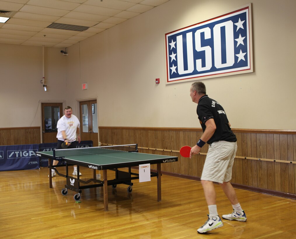 Two members of the Camp Lejeune Ping Pong team battle at the 4th annual table tennis tournament at the USO on Nov. 6. The tournament was held as a fundraiser to celebrate the USO’s 70th anniversary.(Official U.S. Marine Corps photo by Pfc. Jackeline M. Perez Rivera)