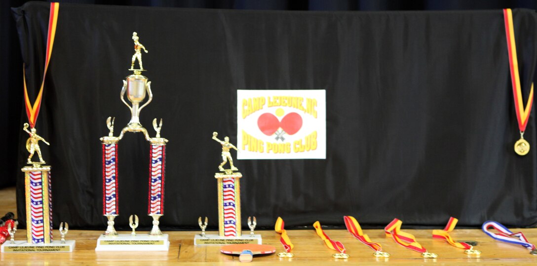 Trophies and awards await being distribution to winners at the Camp Lejeune Ping Pong Tournament at the Jacksonville USO Nov. 6. The Camp Lejeune Ping Pong Club meets bimonthly at the USO. (Official U.S. Marine Corps photo by Pfc. Jackeline M. Perez Rivera)