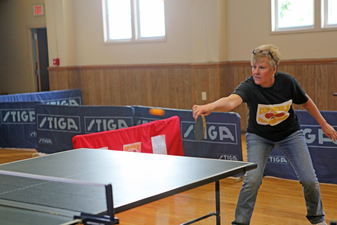 Barb Sanchez hits the ball at the Camp Lejeune Ping Pong Tournament at the Jacksonville USO Nov. 6. She won third place in the intermediate tournament. (Official U.S. Marine Corps photo by Pfc. Jackeline M. Perez Rivera)