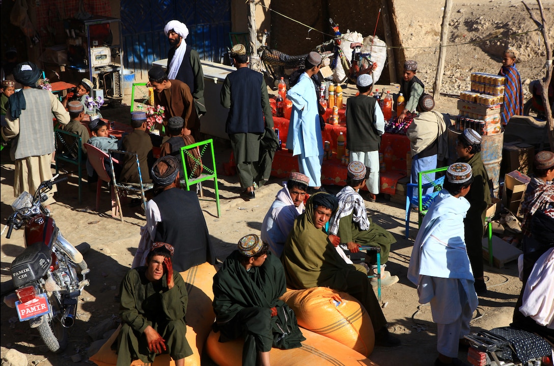 Afghan locals shop, visit and work in a bazaar in Helmand province, Afghanistan, Nov. 6.  A convoy with Marines from 7th Engineer Support Battalion, 2nd Marine Logistics Group (Forward), passed through the bustling bazaar on their way to conduct Route 611 repairs in the surrounding area.  (U.S. Marine Corps photo by Cpl. Katherine M. Solano)
