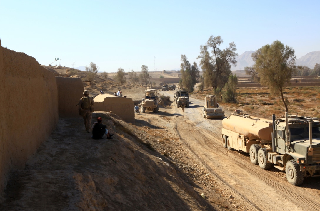 Marines with 7th Engineer Support Battalion, 2nd Marine Logistics Group (Forward), conduct route repairs along Route 611 in Helmand province, Afghanistan, Nov. 6.  The repairs were completed over the span of multiple days in support of Operation Eastern Storm.  (U.S. Marine Corps photo by Cpl. Katherine M. Solano)