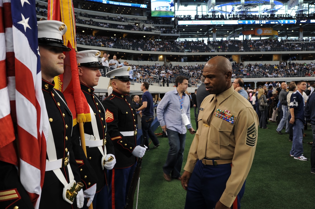 U.S. Marine Corps Sgt. Maj. JB Edwards Jr., Sgt. Maj., 8th Marine Corps District (8MCD), looks over the 8MCD color gaurd prior to the kick off of the Seattle Seahawks vs. Dallas Cowboys at Cowboys Stadium, Arlington, Texas, Jan. 6, 2011. Edwards is the senior enlisted Marine for the 8MCD. (U.S.  Marine Corps photo by Lance Cpl. Alfredo V. Ferrer)