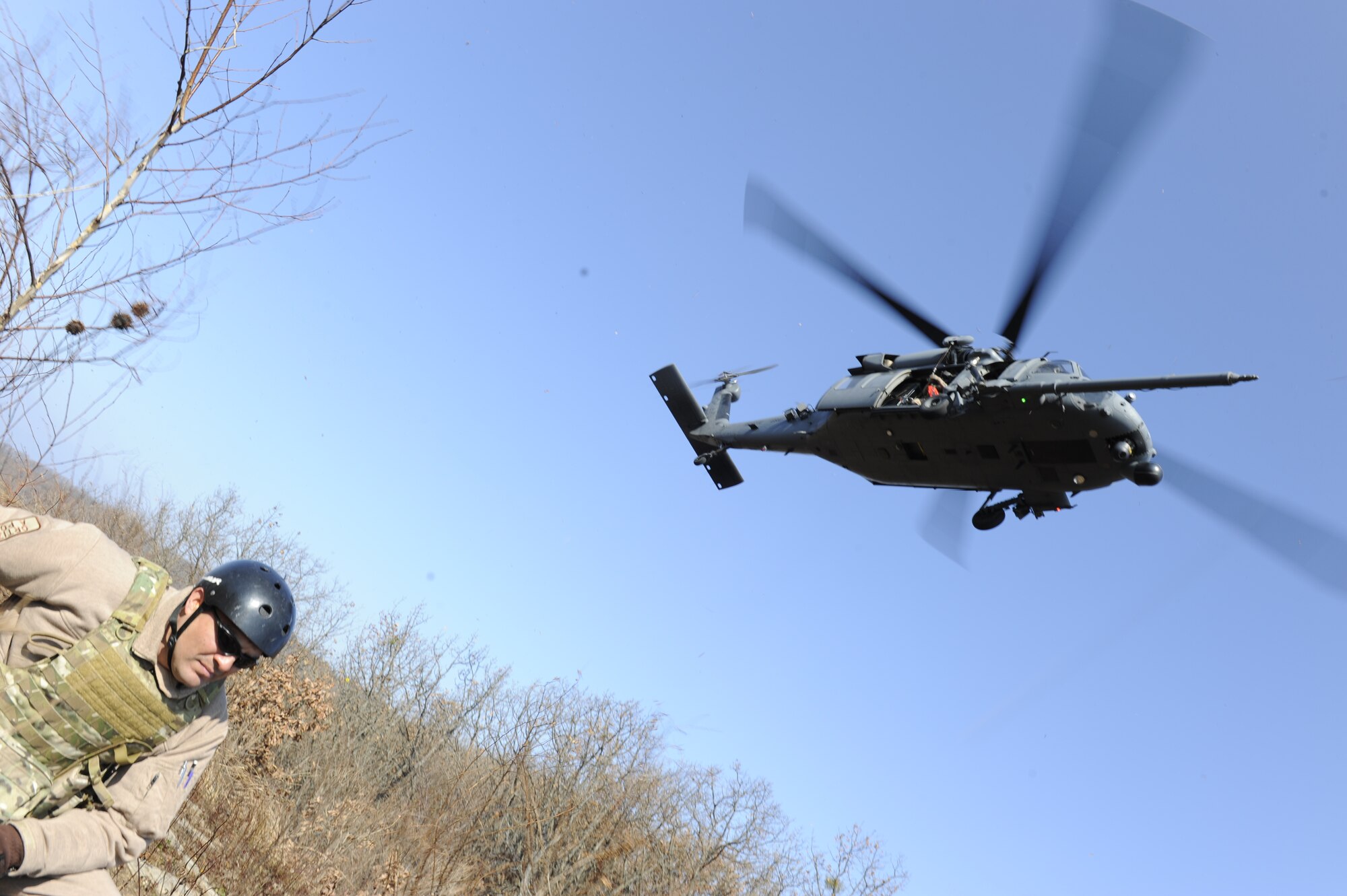 U.S. Air Force Lt. Col. Pete Ortiz Jr., 33rd Rescue Squadron director of operations on Kadena Air Base, Japan, is hoisted down from a rescue helicopter during exercise PACIFIC THUNDER Nov. 3 near Osan Air Base, Republic of Korea.
PACIFIC THUNDER is a 10-day exercise from Oct. 31 to Nov. 9 at Osan AB. The exercise involves the 33rd Rescue Squadron from Kadena AB, Japan, and the 25th Fighter Squadron from Osan. These units work together to practice combat search and rescue tactics to prepare for real-world emergency situations. (U.S. Air Force photo/Tech. Sgt. Angelique Bilog/released)
