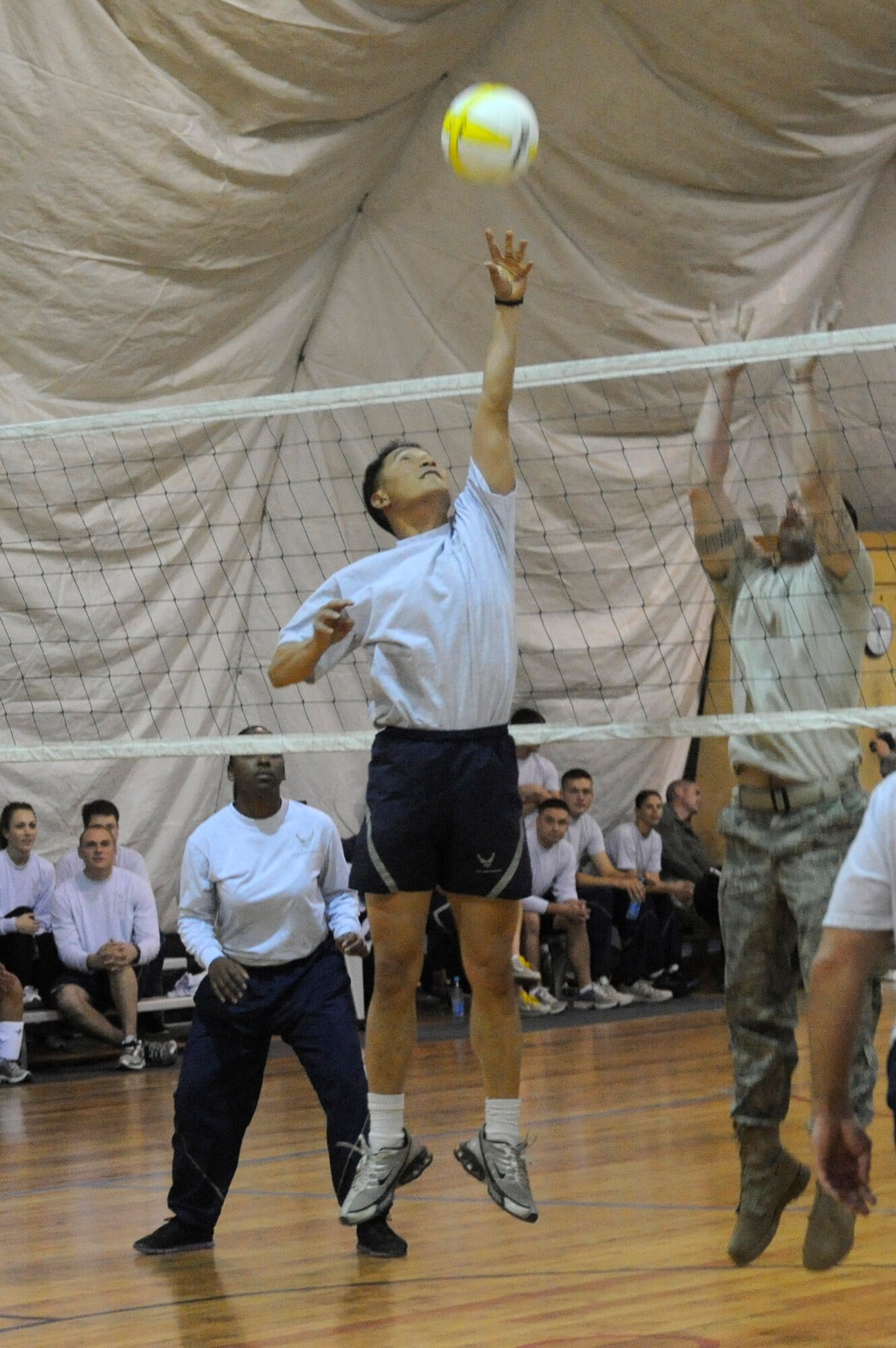 Maj. Alan Villanueva returns a set during a volleyball tournament at the Transit Center at Manas, Kyrgyzstan, Nov. 5. The Wing Staff Agency team defeated the 376th Expeditionary Security Forces Squadron Team in a double elimination game moving them to the semi-final round of competition. The WSA Team earned second place in the tournament. Villanueva is deployed as the Theater Security Cooperation Humanitarian Assistance Branch chief from Redstone Arsenal, Ala. (U.S. Air Force photo/Tech. Sgt. Tammie Moore)
