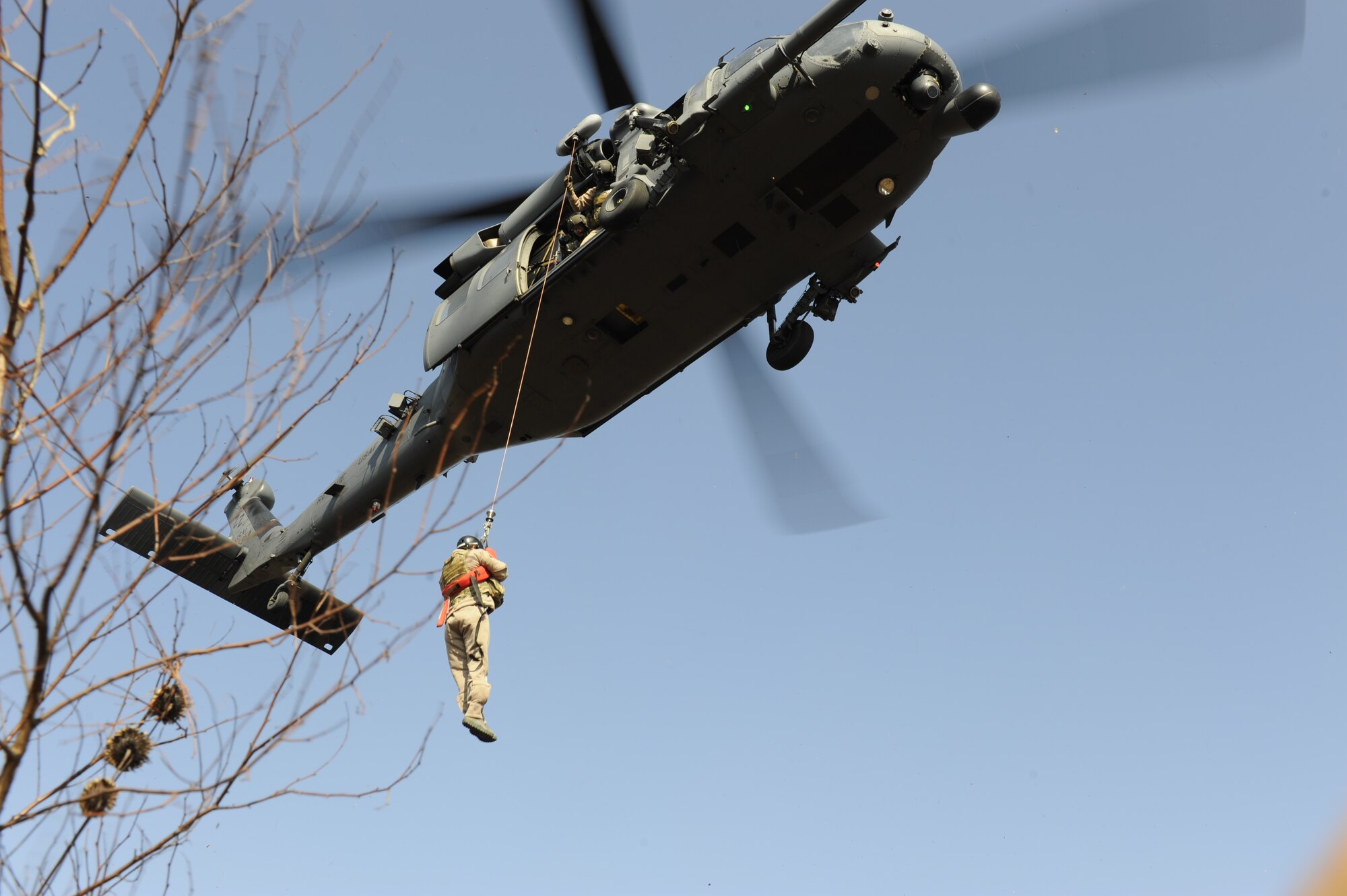 U.S. Air Force Lt. Col. Pete Ortiz Jr., 33rd Rescue Squadron director of operations on Kadena Air Base, Japan, is hoisted up to a rescue helicopter during exercise PACIFIC THUNDER Nov. 3 near Osan Air Base, Republic of Korea.
PACIFIC THUNDER is a 10-day exercise from Oct. 31 to Nov. 9 at Osan AB. The exercise involves the 33rd Rescue Squadron from Kadena AB, Japan, and the 25th Fighter Squadron from Osan. These units work together to practice combat search and rescue tactics to prepare for real-world emergency situations. (U.S. Air Force photo/Tech. Sgt. Angelique Bilog/released)
