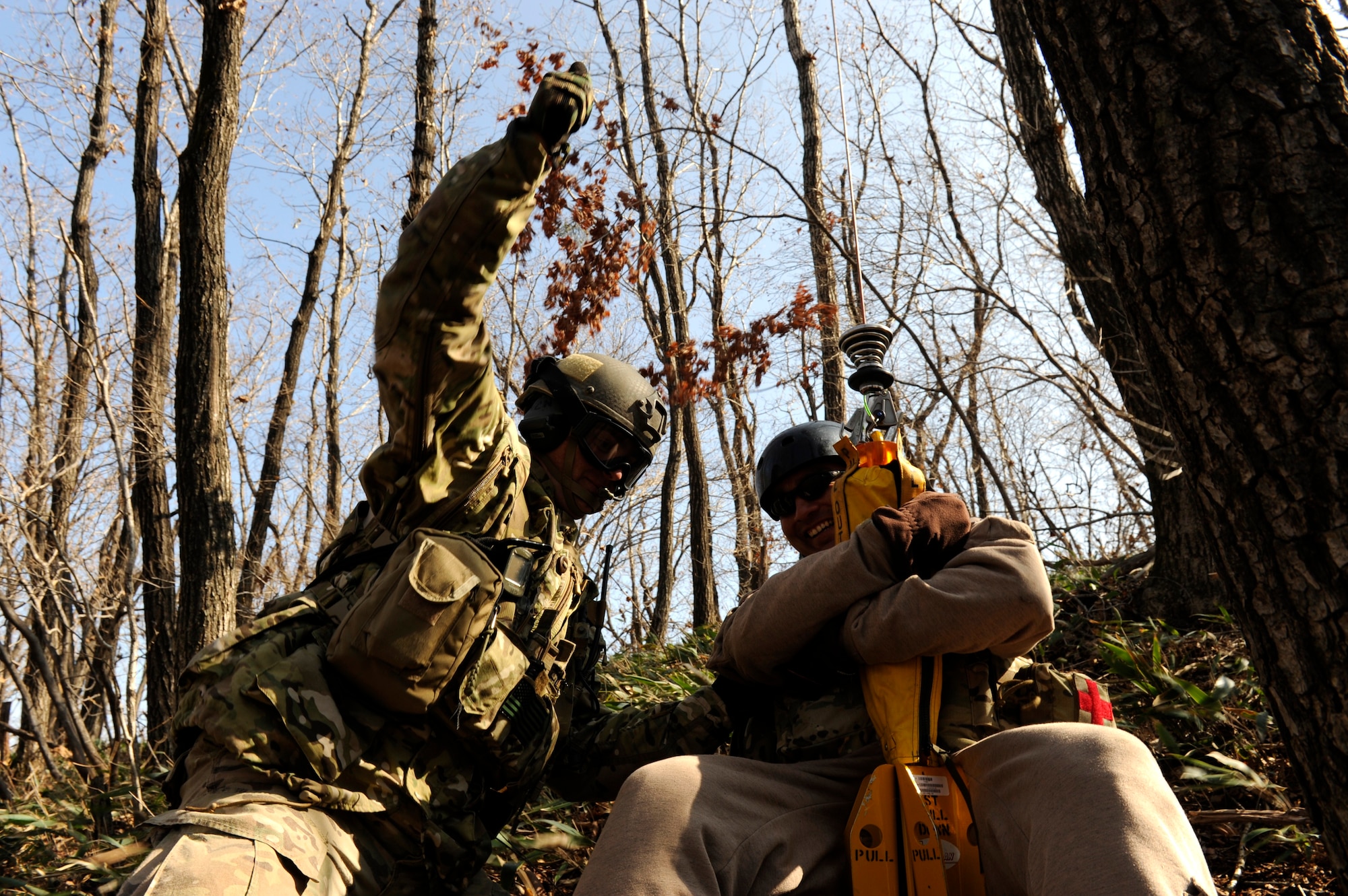 U.S. Air Force Staff Sgt. Robert Colliton, Survival Evasion Resistance Escape specialist from the 18th Operation Support Squadron on Kadena Air Base, Japan, signals the okay to hoist U.S. Air Force Lt. Col. Pete Ortiz Jr., 33rd Rescue Squadron director of operations at Kadena AB, up to a rescue helicopter during exercise PACIFIC THUNDER Nov. 3 near Osan Air Base, Republic of Korea.
PACIFIC THUNDER is a 10-day exercise from Oct. 31 to Nov. 9 at Osan AB. The exercise involves the 33rd Rescue Squadron from Kadena AB, Japan, and the 25th Fighter Squadron from Osan. These units work together to practice combat search and rescue tactics to prepare for real-world emergency situations. (U.S. Air Force photo/Tech. Sgt. Angelique Bilog/released)
