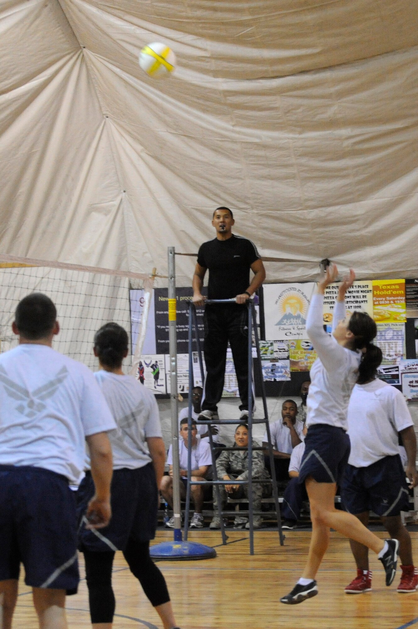 Airman 1st Class Linda Villalpando anticipates the ball during a volleyball tournament at the Transit Center at Manas, Kyrgyzstan, Nov. 5. The 376th Expeditionary Civil Engineer Squadron Escort Flight defeated the 376th Expeditionary Force Support Squadron team in a double elimination game moving them onto the semi-final round of the competition. Villalpando is a 376th ECES escort deployed from Nellis Air Force Base, Nev. (U.S. Air Force photo/Tech. Sgt. Tammie Moore)