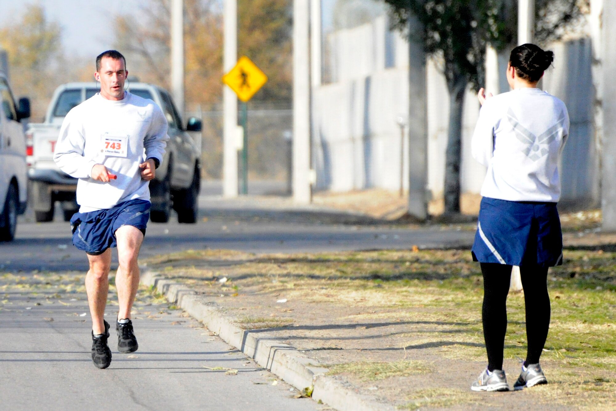 Staff Sgt. James Curtis races toward the finish line during a Commander’s Cup 10k relay race at the Transit Center at Manas, Kyrgyzstan, Nov. 5.  Curtis completed the race at 43:03, earning the 376th Expeditionary Security Forces Squadron first place. Curtis is deployed to the 376th ESFS from Beale Air Force Base, Calif. (U.S. Air Force photo/Tech. Sgt. Tammie Moore) 