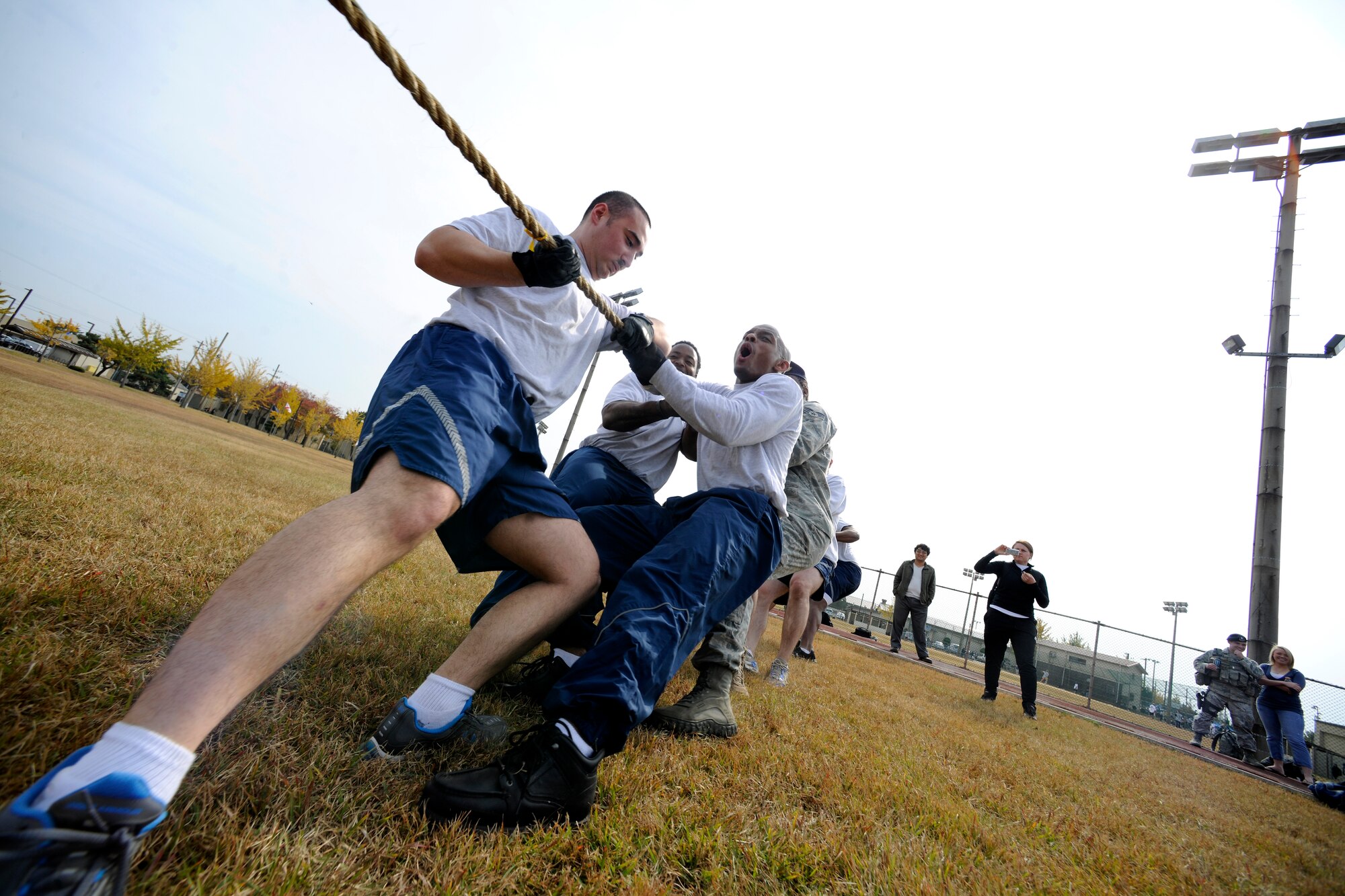 The 8th Security Forces Squadron team pulls the rope against the Korean Union team during a tug-of-war event as part of the Korean-American Sports Day at Kunsan Air Base, Republic of Korea, Nov. 2, 2011. The day had various events including softball, tug-of-war and paintball. (U.S. Air Force photo by Staff Sgt. Rasheen Douglas/Released)