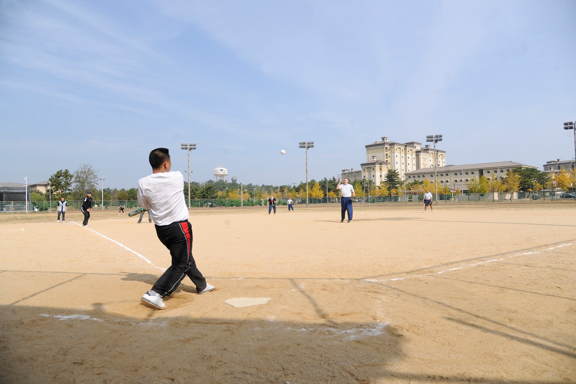 A member of the Republic of Korea Air Force strikes the softball for a base hit while playing the 8th Force Support Squadron team during the Korean-American Sports Day at Kunsan Air Base, Republic of Korea, Nov. 2, 2011. The day had various events including softball, tug-of-war and paintball. (U.S. Air Force photo by Staff Sgt. Rasheen Douglas/Released)