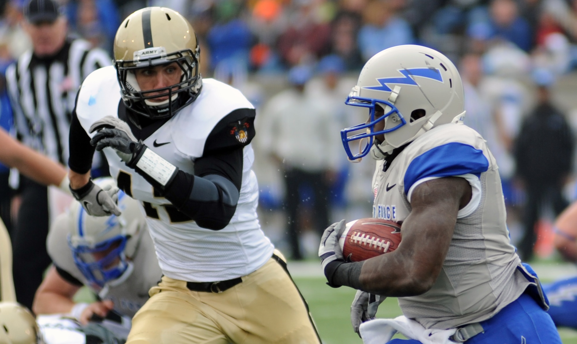 Air Force running back Asher Clark gets the corner during the Air Force-Army game at Falcon Stadium Nov. 5, 2011. Clark rushed for 78 yards on 16 attempts. The Falcons scored 21 points in the third quarter en route to a 24-14 victory over the Black Knights and their second consecutive Commander-in-Chief's Trophy. (U.S. Air Force photo/Tech. Sgt. Raymond Hoy)