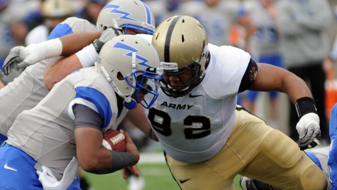 Air Force quarterback Tim Jefferson runs up the middle during the Air Force-Army game at Falcon Stadium Nov. 5, 2011. Jefferson rushed for 66 yards on 20 attempts with two touchdowns. The Falcons scored 21 points in the third quarter en route to a 24-14 victory over the Black Knights and their second consecutive Commander-in-Chief's Trophy. (U.S. Air Force photo/Tech. Sgt. Raymond Hoy)